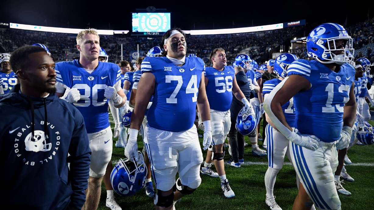BYU players walk off the field as their hopes of a perfect season are crushed by Kansas at LaVell Edwards Stadium in Provo on Saturday Nov. 16, 2024. Kansas won 17-13.