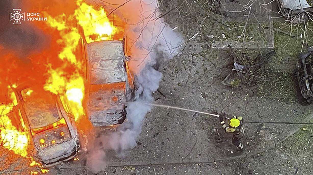 In this photo provided by the Ukrainian Emergency Service, emergency services personnel work to extinguish a fire following a Russian rocket attack in Poltava region Ukraine on Sunday.