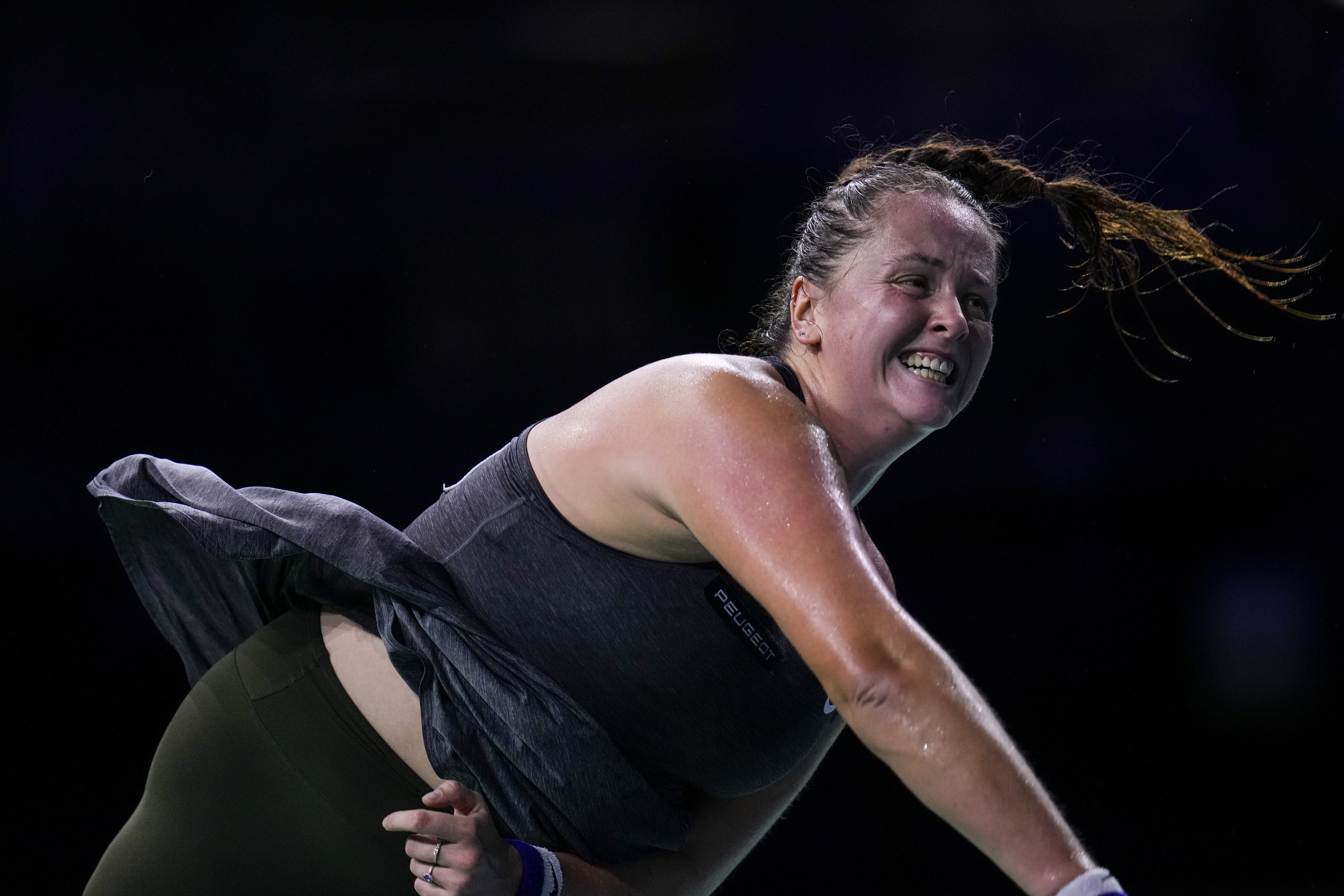 Slovakia's Viktoria Hruncakova returns the ball to Australia's Kimberly Birrell during the Billie Jean King Cup Finals, at the Martin Carpena Sports Hall, in Malaga, southern Spain, on Sunday, Nov. 17, 2024.