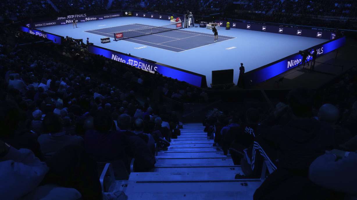 United States' Taylor Fritz, right, serves the ball to Australia's Alex de Minaur during their singles tennis match of the ATP World Tour Finals at the Inalpi Arena, in Turin, Italy, Thursday, Nov. 14, 2024.
