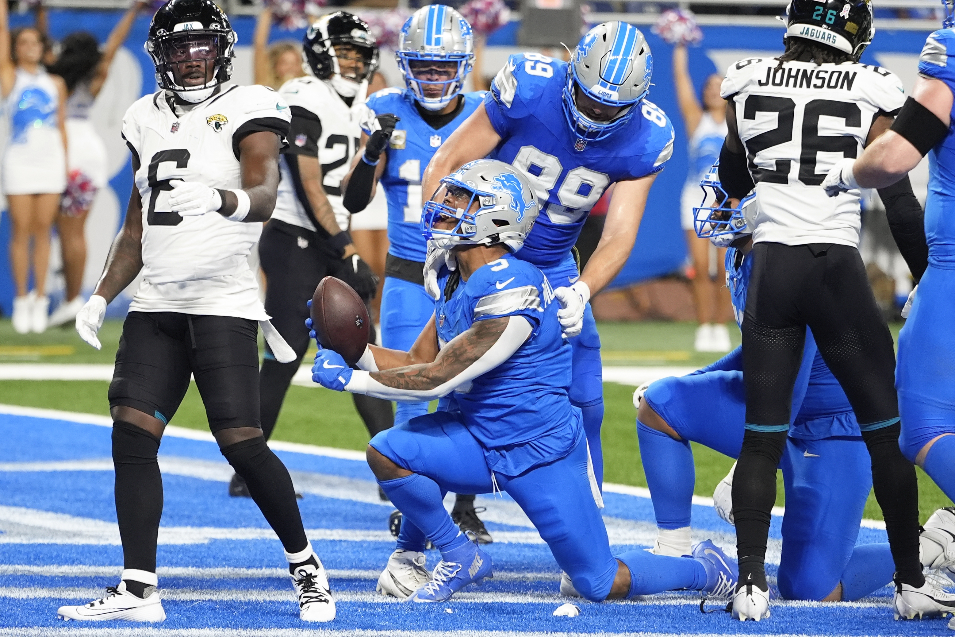 Detroit Lions running back David Montgomery (5) celebrates his six-yard touchdown run against the Jacksonville Jaguars during the first half of an NFL football game, Sunday, Nov. 17, 2024, in Detroit.