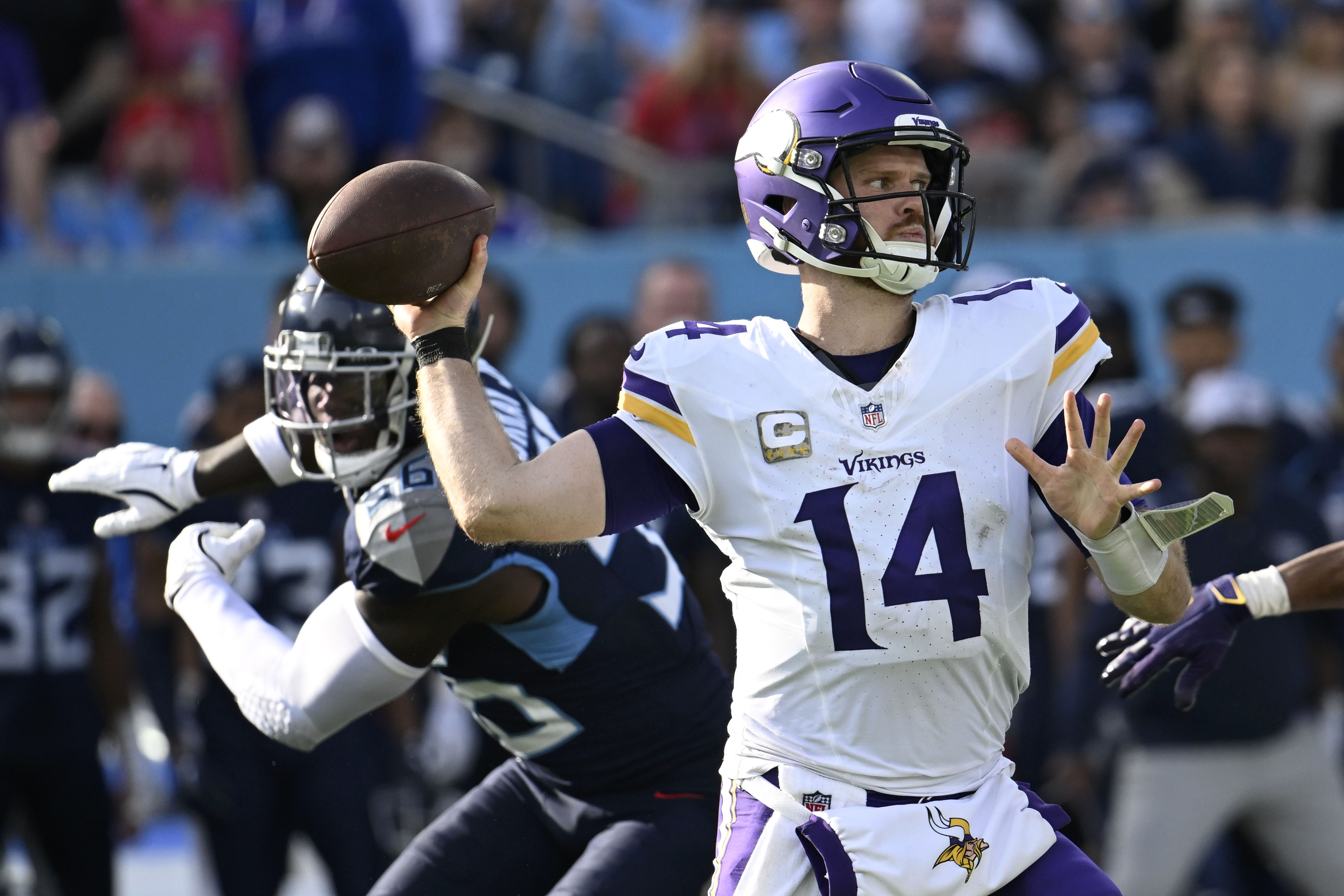 Minnesota Vikings quarterback Sam Darnold (14) throws a pass during the second half of an NFL football game against the Tennessee Titans, Sunday, Nov. 17, 2024, in Nashville, Tenn. 