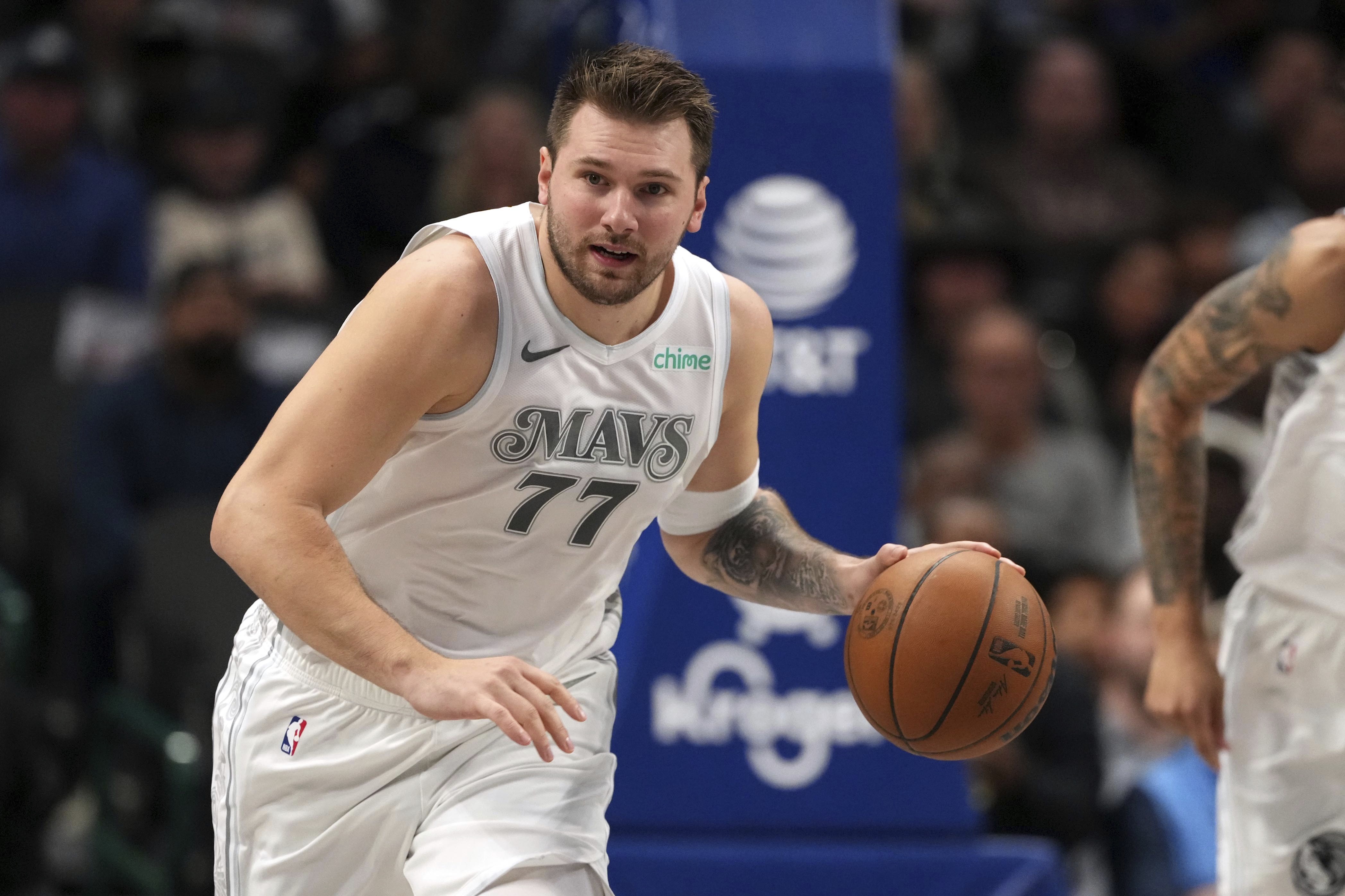 Dallas Mavericks guard Luka Doncic brings the ball up the court during the first half of an NBA basketball game against the San Antonio Spurs Saturday, Nov. 16, 2024, in Dallas. 