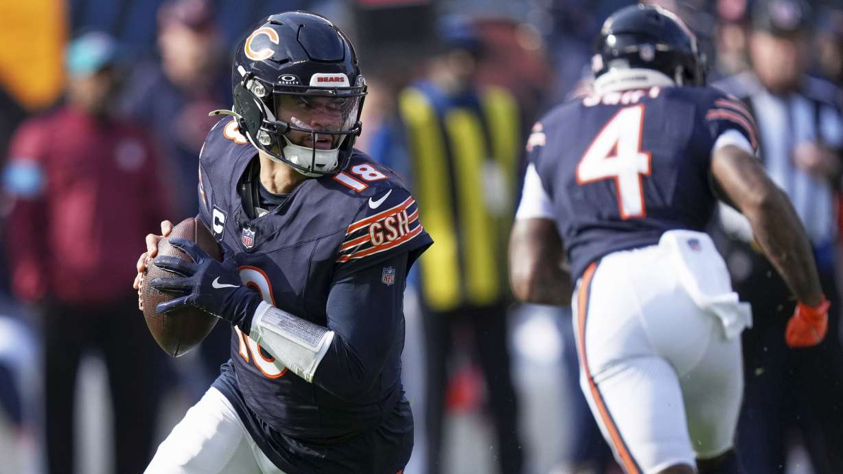 Chicago Bears' Caleb Williams drops back during the first half of an NFL football game against the Green Bay Packers Sunday, Nov. 17, 2024, in Chicago.