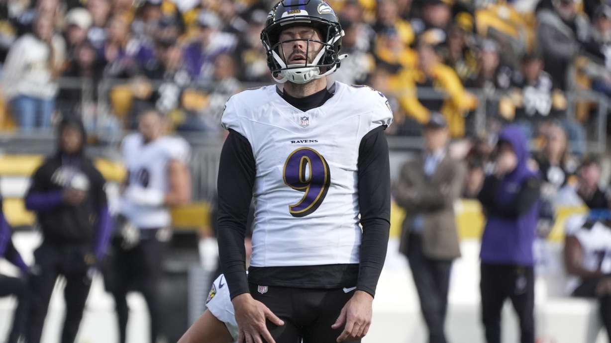 Baltimore Ravens place kicker Justin Tucker reacts after missing a field goal against the Pittsburgh Steelers during the first half of an NFL football game, Sunday, Nov. 17, 2024, in Pittsburgh.