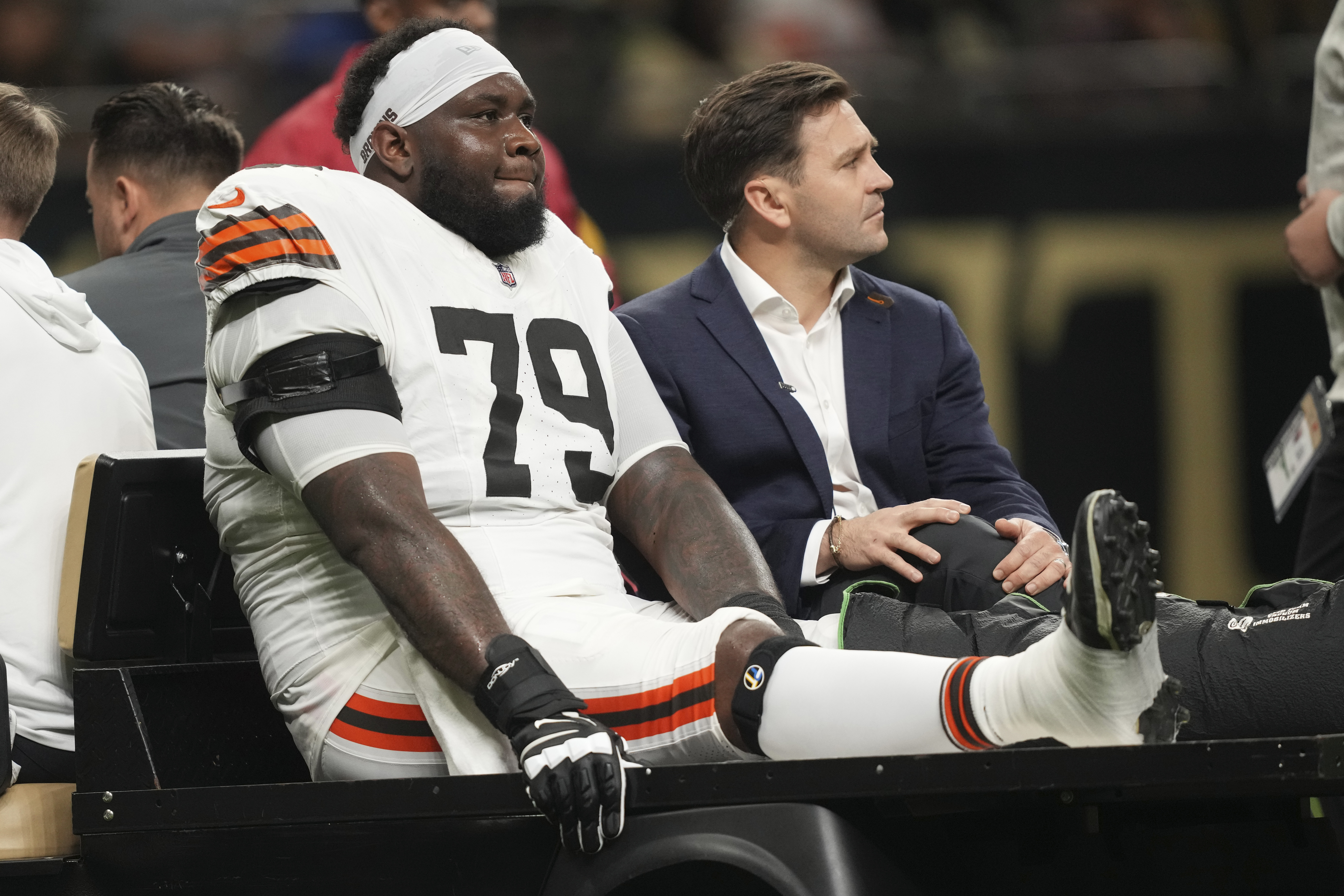 Cleveland Browns offensive tackle Dawand Jones (79) is carted off the field after an injury in the first half of an NFL football game against the New Orleans Saints in New Orleans, Sunday, Nov. 17, 2024. 