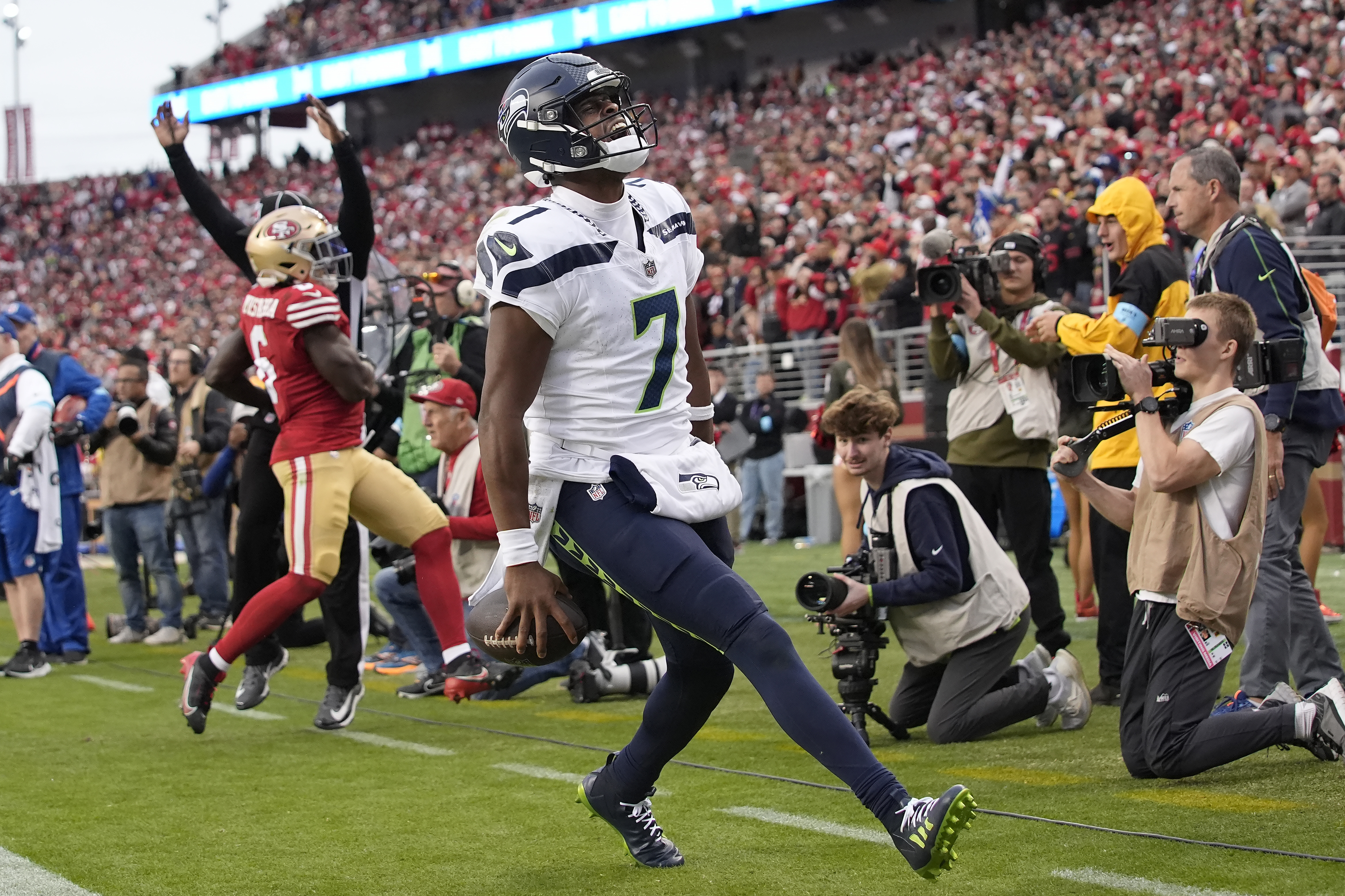Seattle Seahawks quarterback Geno Smith (7) reacts after scoring against the San Francisco 49ers during the second half of an NFL football game in Santa Clara, Calif., Sunday, Nov. 17, 2024.
