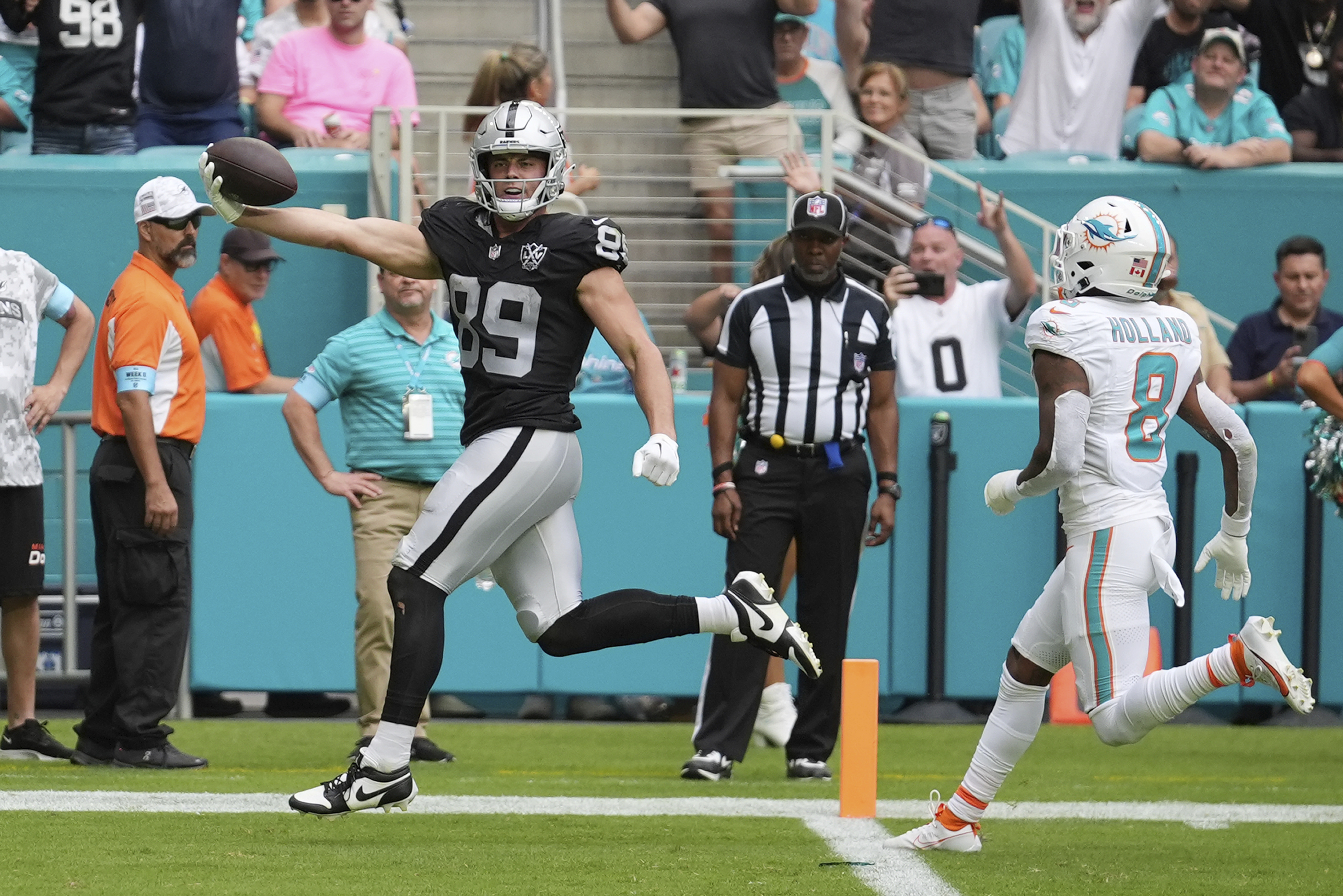 Las Vegas Raiders tight end Brock Bowers (89) scores a touchdown during the second half of an NFL football game against the Miami Dolphins, Sunday, Nov. 17, 2024, in Miami Gardens, Fla.