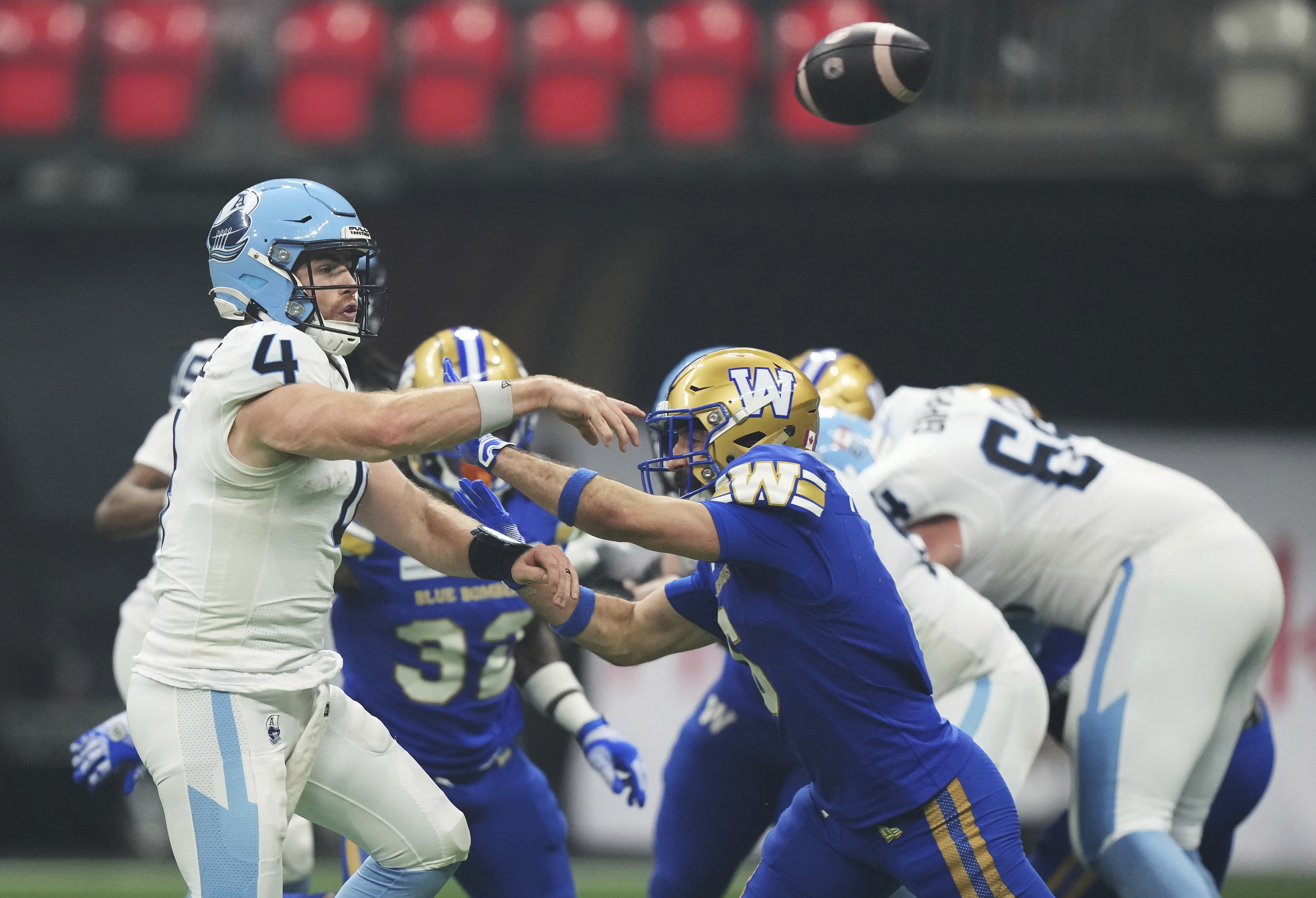 Toronto Argonauts quarterback Nick Arbuckle (4) passes against the Winnipeg Blue Bombers during the second half of a CFL football game at the 111th Grey Cup in Vancouver, British Columbia, Sunday, Nov. 17, 2024. 