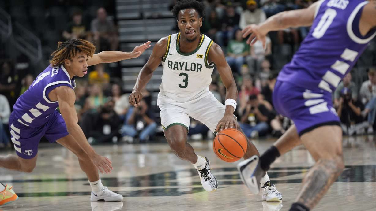 Baylor guard Jeremy Roach (3) dribbles against Tarleton State guards Jordan Mizell (4) and Izzy Miles (0) during the first half of an NCAA college basketball game, Sunday, Nov. 17, 2024, in Waco, Texas.