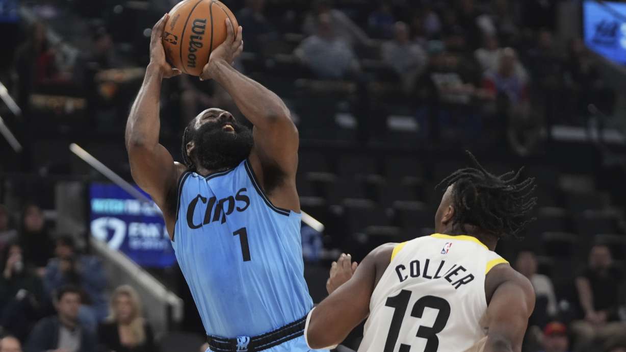 Los Angeles Clippers guard James Harden, left, shoots as Utah Jazz guard Isaiah Collier defends during the first half of an NBA basketball game, Sunday, Nov. 17, 2024, in Inglewood, Calif.