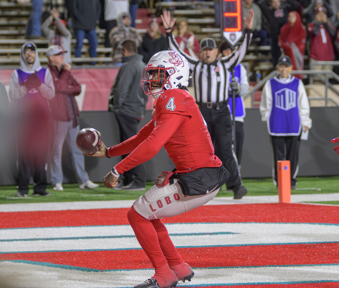 New Mexico's quarterback Devon Dampier runs into the end zone for a go ahead touchdown late in the fourth quarter against Washington State during an NCAA college football game Saturday, Nov. 16, 2024 in Albuquerque, N.M. 