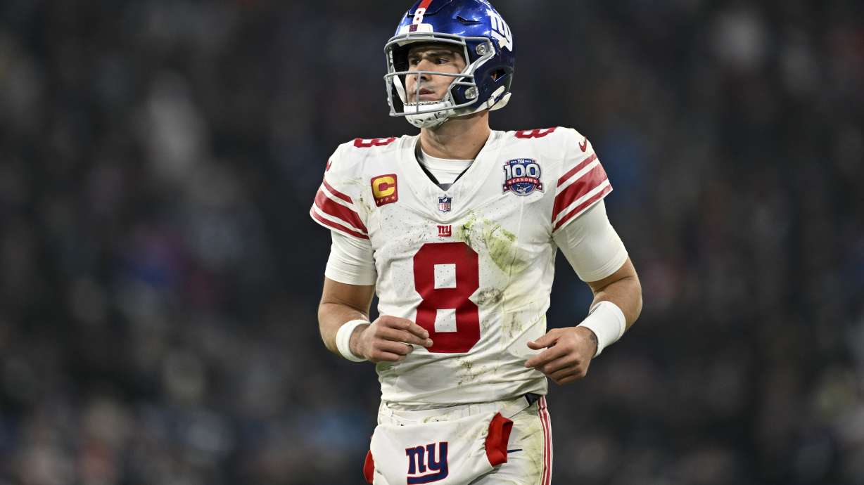 New York Giants quarterback Daniel Jones watches during the second half of an NFL football game against the Carolina Panthers, Sunday, Nov. 10, 2024, in Munich, Germany.