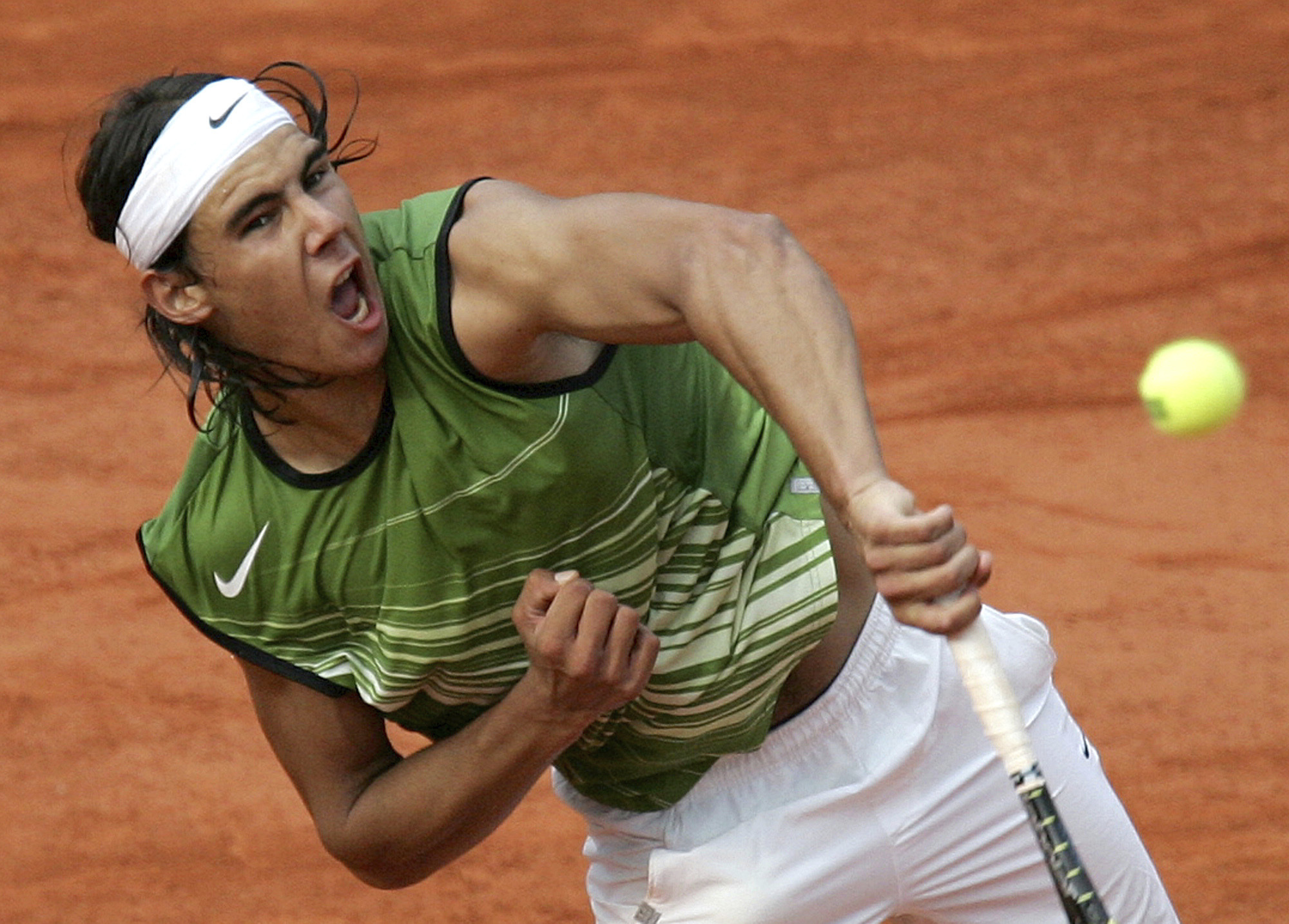 FILE - Spain's Rafael Nadal serves to Switzerland's Roger Federer during their semifinal match of the French Open tennis tournament, at the Roland Garros stadium, June 3, 2005 in Paris. 