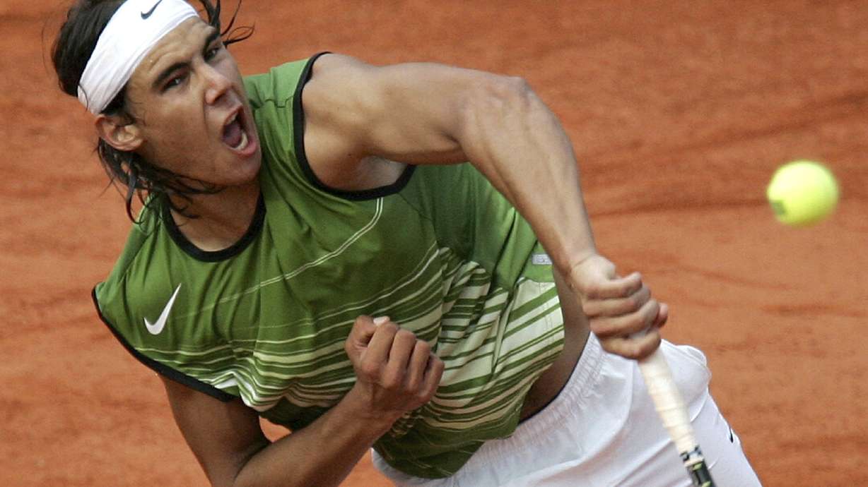 FILE - Spain's Rafael Nadal serves to Switzerland's Roger Federer during their semifinal match of the French Open tennis tournament, at the Roland Garros stadium, June 3, 2005 in Paris.