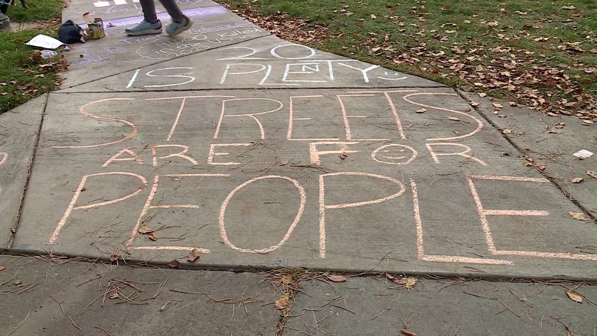 Chalk writing advocates for safe streets in Salt Lake City on Sunday.