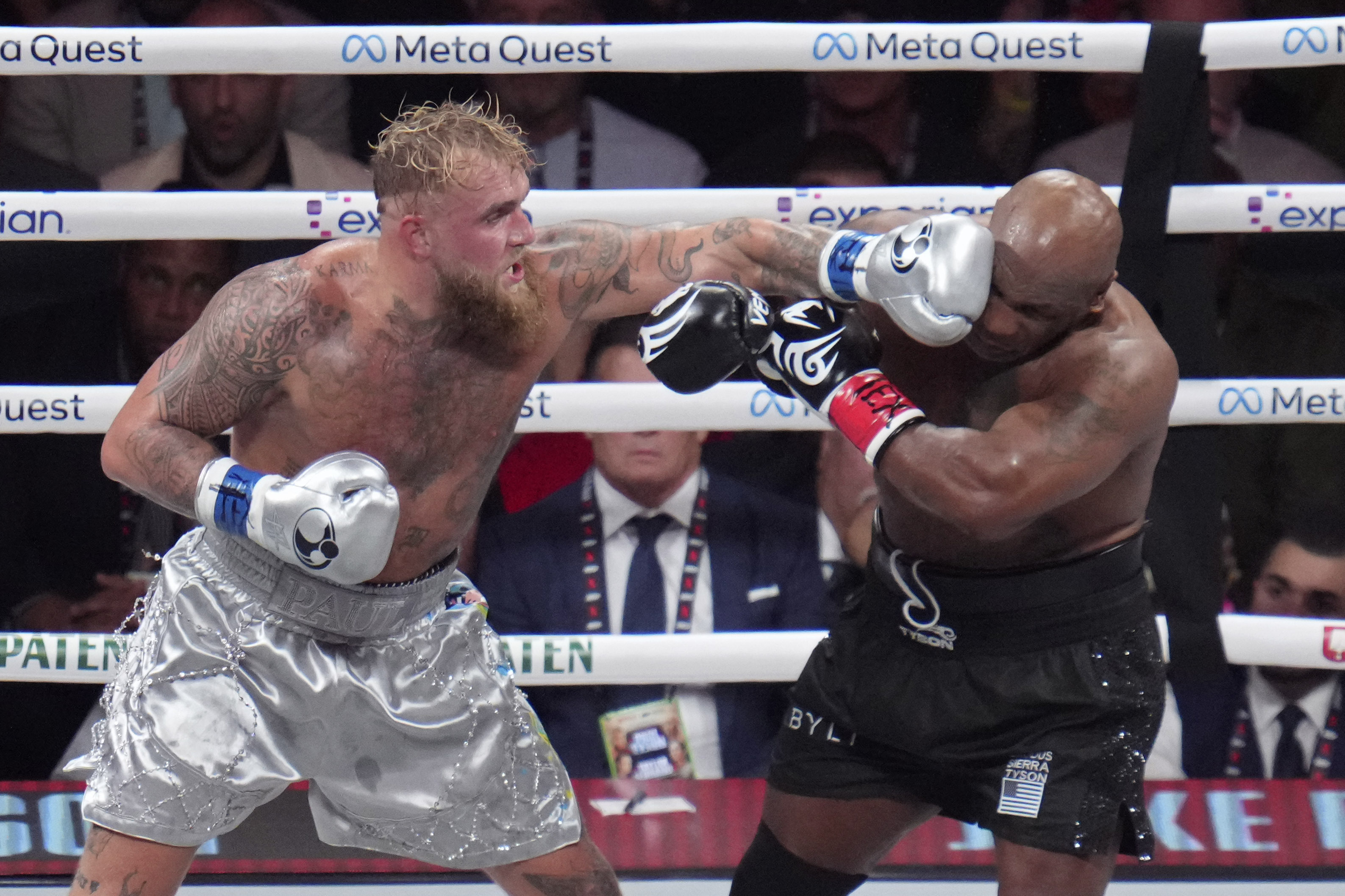 Jake Paul lands a left to Mike Tyson during their heavyweight boxing match, Friday, Nov. 15, 2024, in Arlington, Texas. 