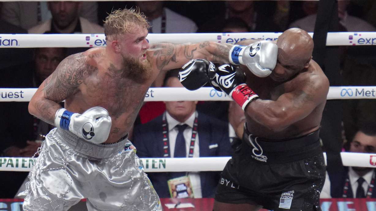 Jake Paul lands a left to Mike Tyson during their heavyweight boxing match, Friday, Nov. 15, 2024, in Arlington, Texas.