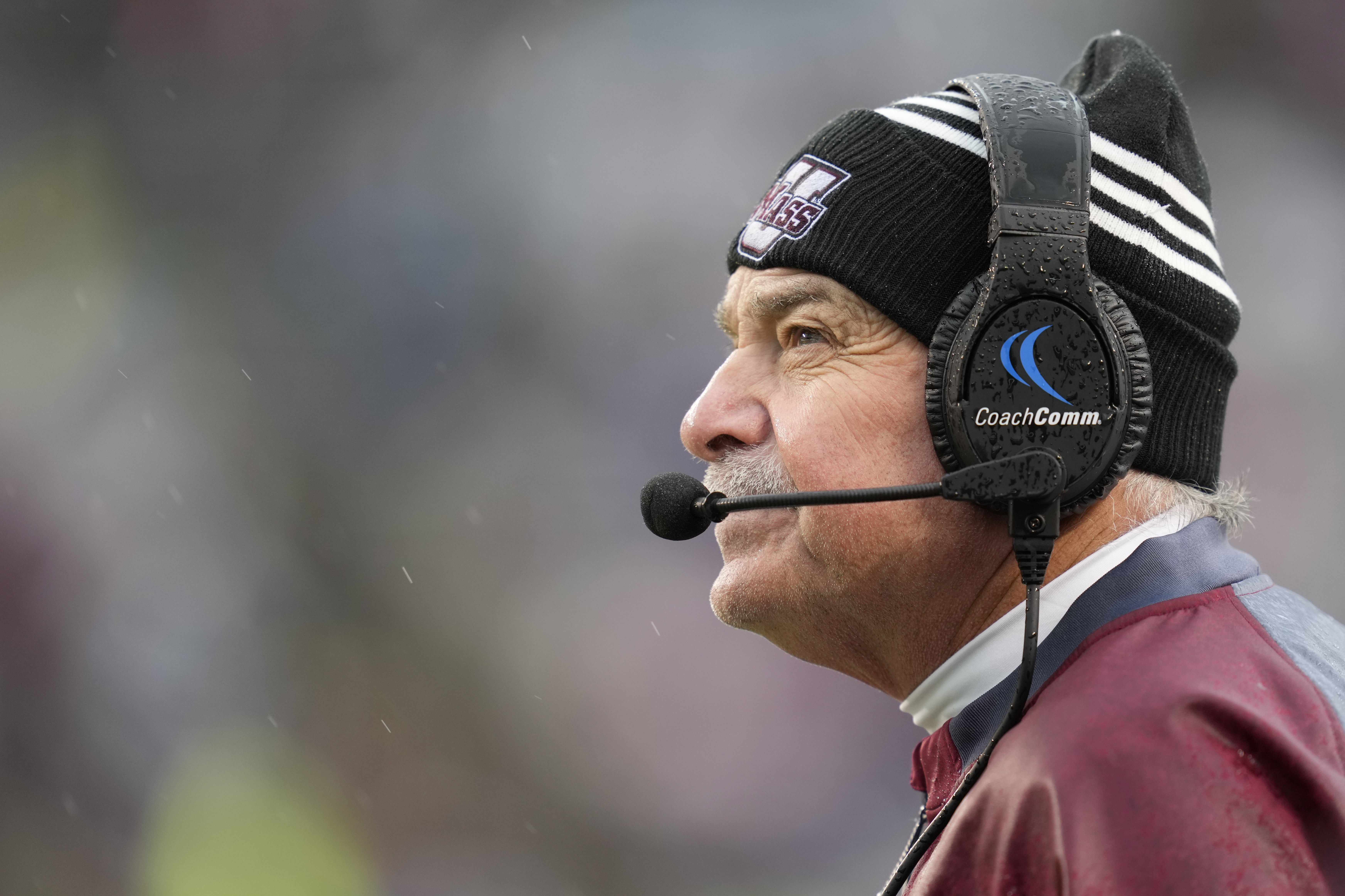 FILE - Massachusetts head coach Don Brown watches a replay against Texas A&M during the first quarter of an NCAA college football game, Nov. 19, 2022, in College Station, Texas. 
