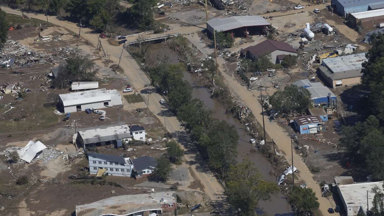Damage from Hurricane Helene near Asheville, N.C., is seen during an aerial tour for President Joe Biden, Oct. 2. Biden is requesting nearly $100 billion in emergency disaster aid after hurricanes Helene and Milton and other natural disasters.