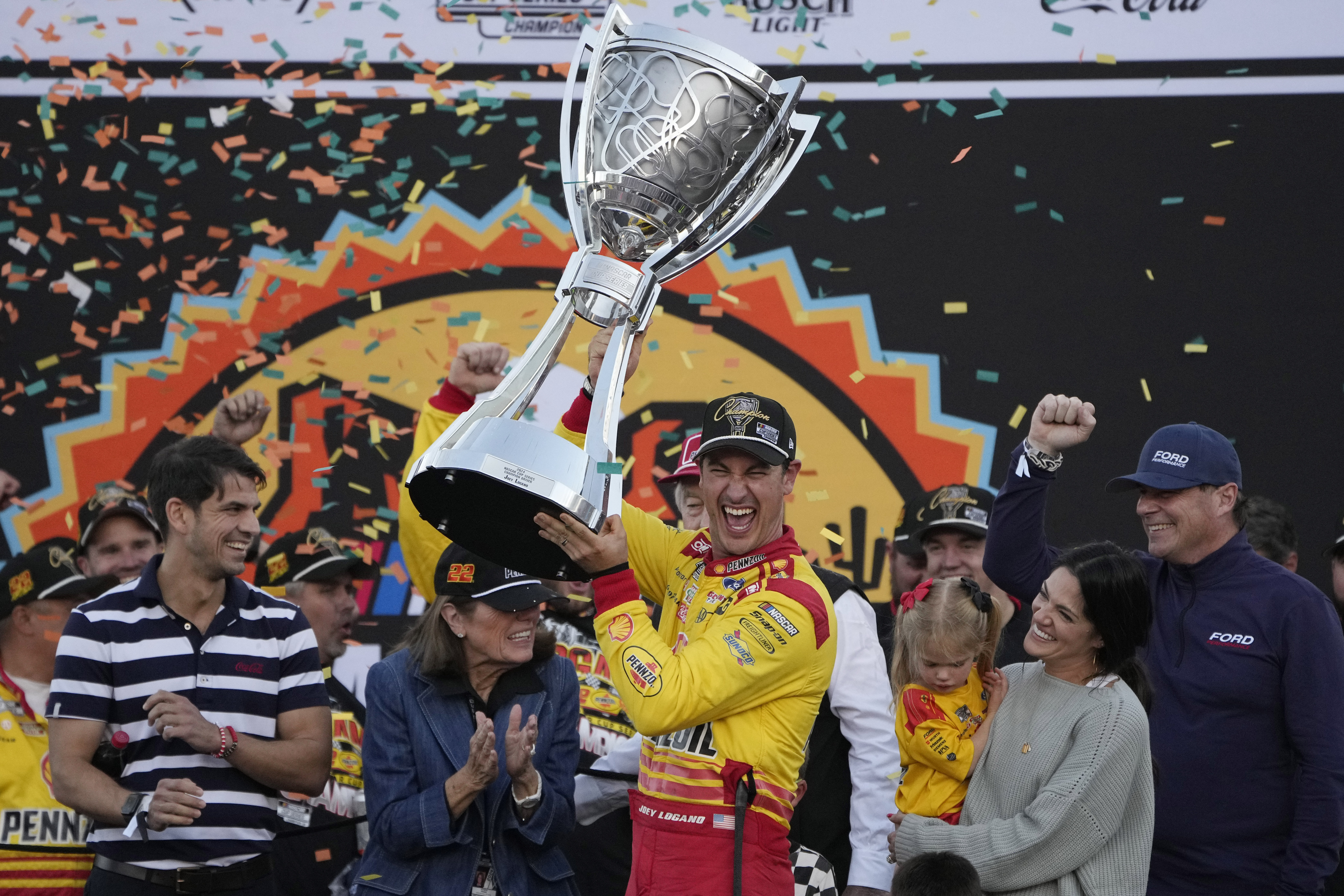 Joey Logano celebrates after winning a NASCAR Cup Series Championship auto race for the championship at Phoenix Raceway, Sunday, Nov. 10, 2024, in Avondale, Ariz.