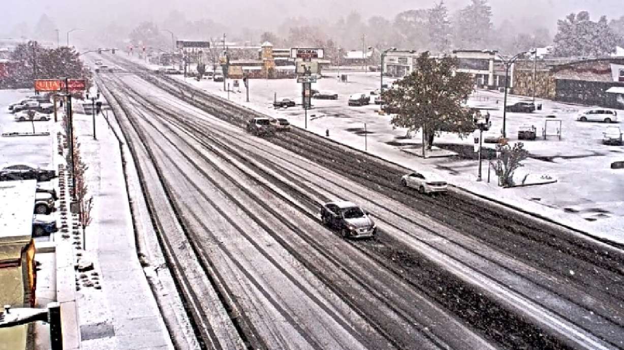 Snow falls on Main Street in Logan on Monday. Meteorologists say lake-effect snow could produce more slick roads across parts of the Wasatch Front and Wasatch Backcountry Tuesday.
