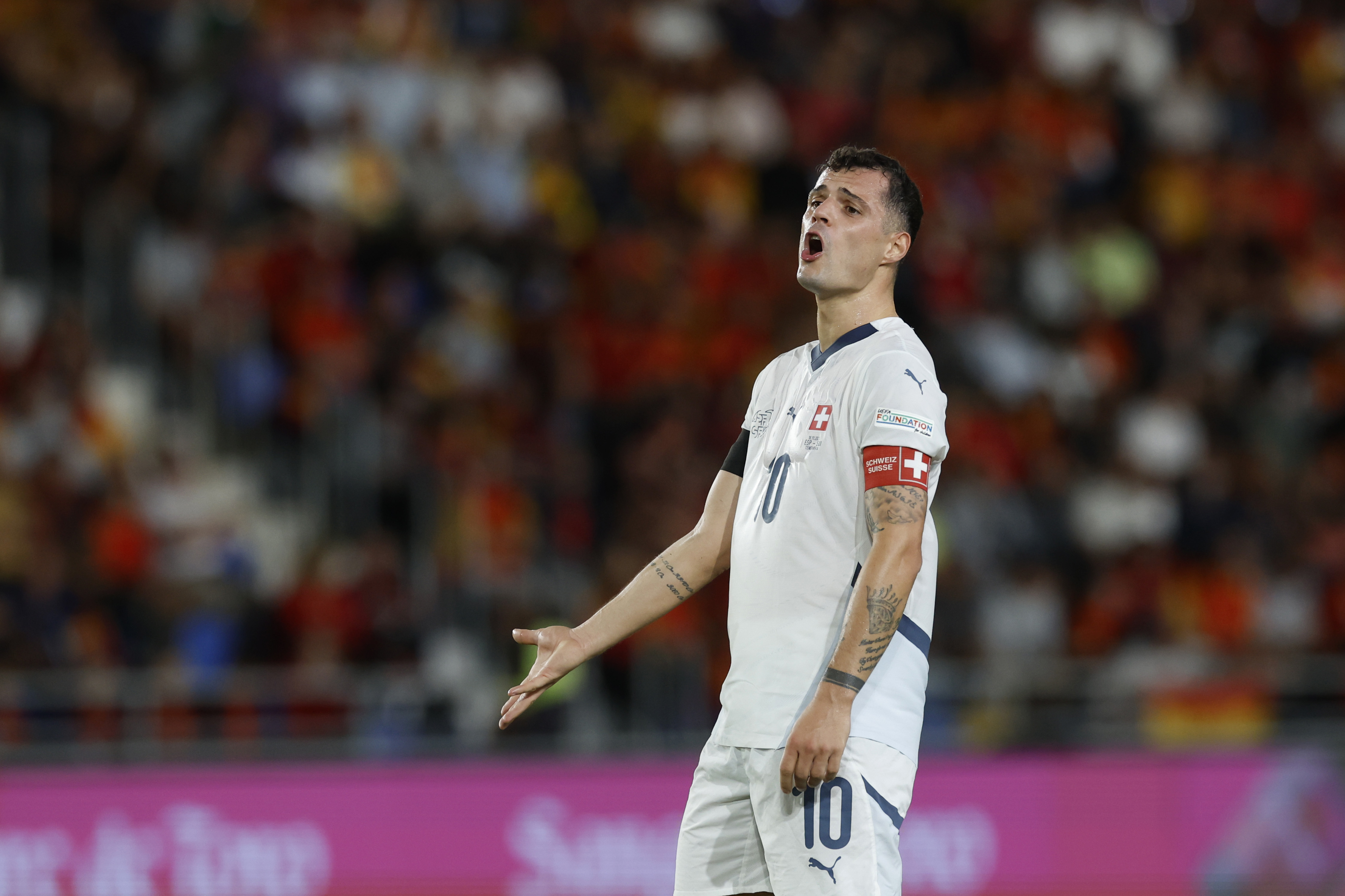 Switzerland's Granit Xhaka reacts during a Nations League soccer match between Spain and Switzerland, at the Heliodoro Rodríguez López stadium in Tenerife, Spain, Monday, Nov. 18, 2024.