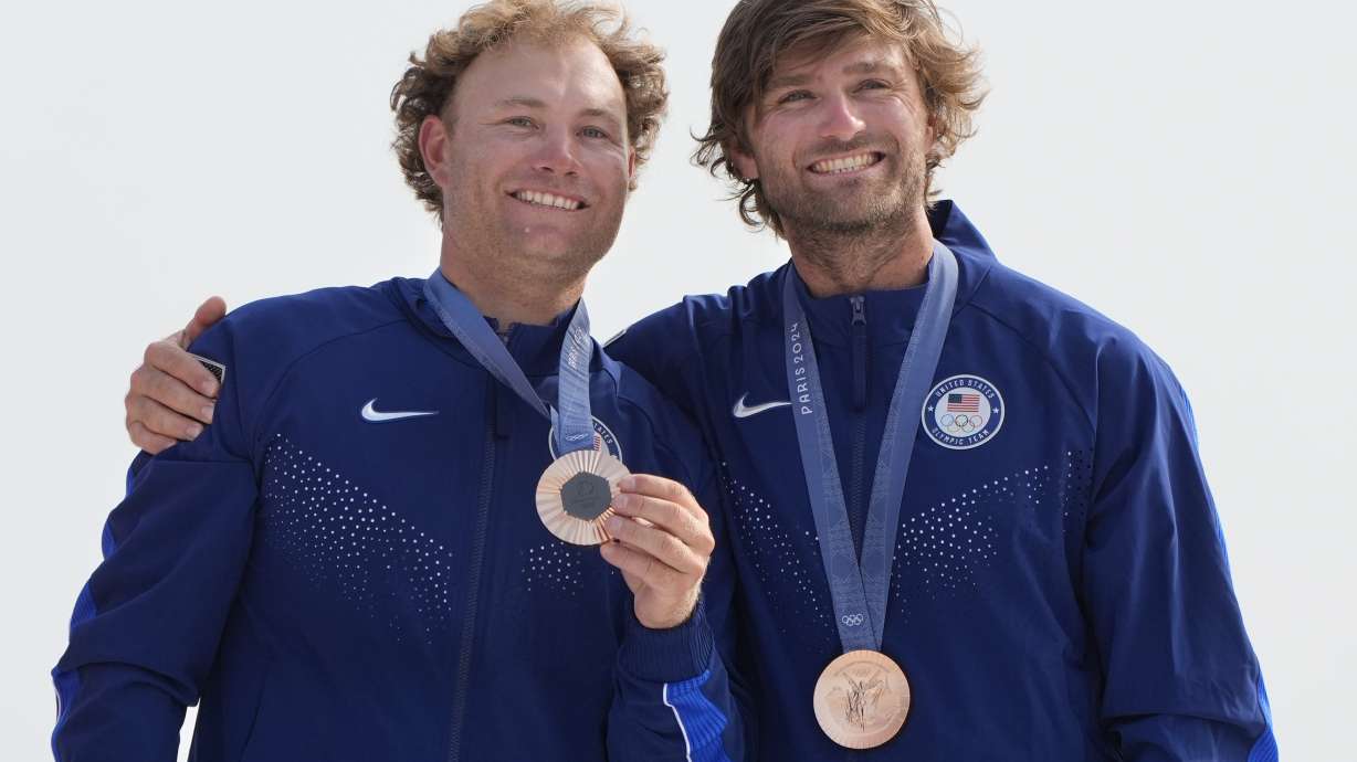 FILE - Olympic bronze medalists Ian Barrows and Hans Henken of the United States, pose with their medals during the men's skiff medal ceremony at the 2024 Summer Olympics, Friday, Aug. 2, 2024, in Marseille, France.