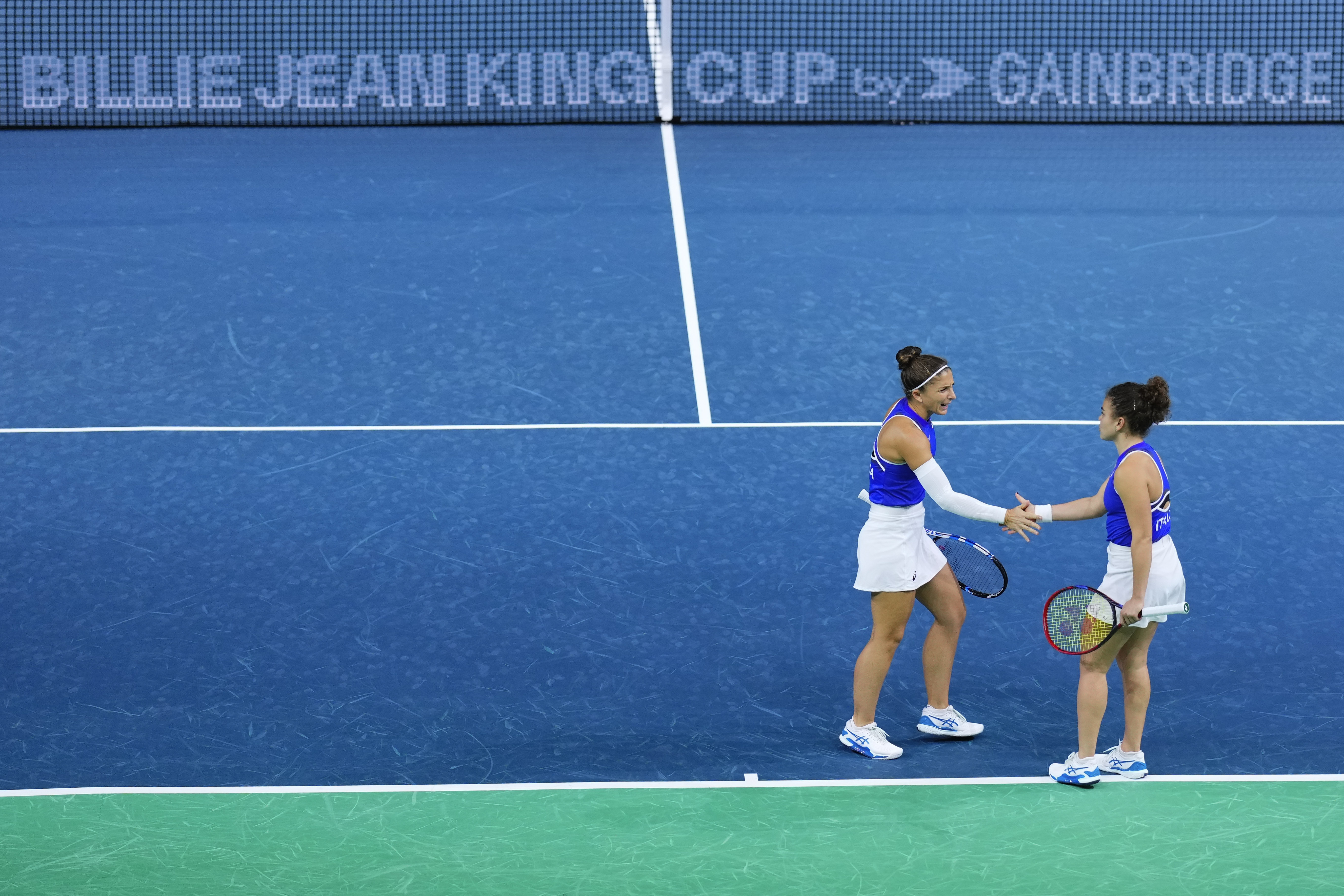 Italy's Sara Errani and Jasmine Paolini, right, compete against Poland's Katarzyna Kawa and Iga Swiatek during the Billie Jean King Cup semi-final at Martin Carpena Sports Hall in Malaga, southern Spain, on Monday, Nov. 18, 2024.