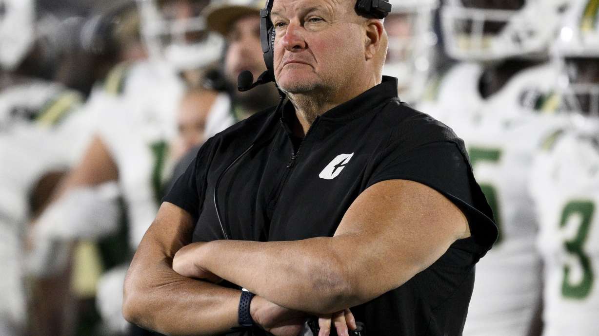FILE - Charlotte head coach Biff Poggi watches the second half of an NCAA college football game against Navy, Oct. 19, 2024, in Annapolis, Md.