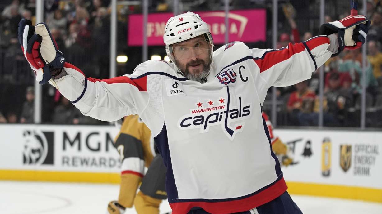 Washington Capitals left wing Alex Ovechkin (8) celebrates after scoring against the Vegas Golden Knights for a hat trick during the third period of an NHL hockey game Sunday, Nov. 17, 2024, in Las Vegas.
