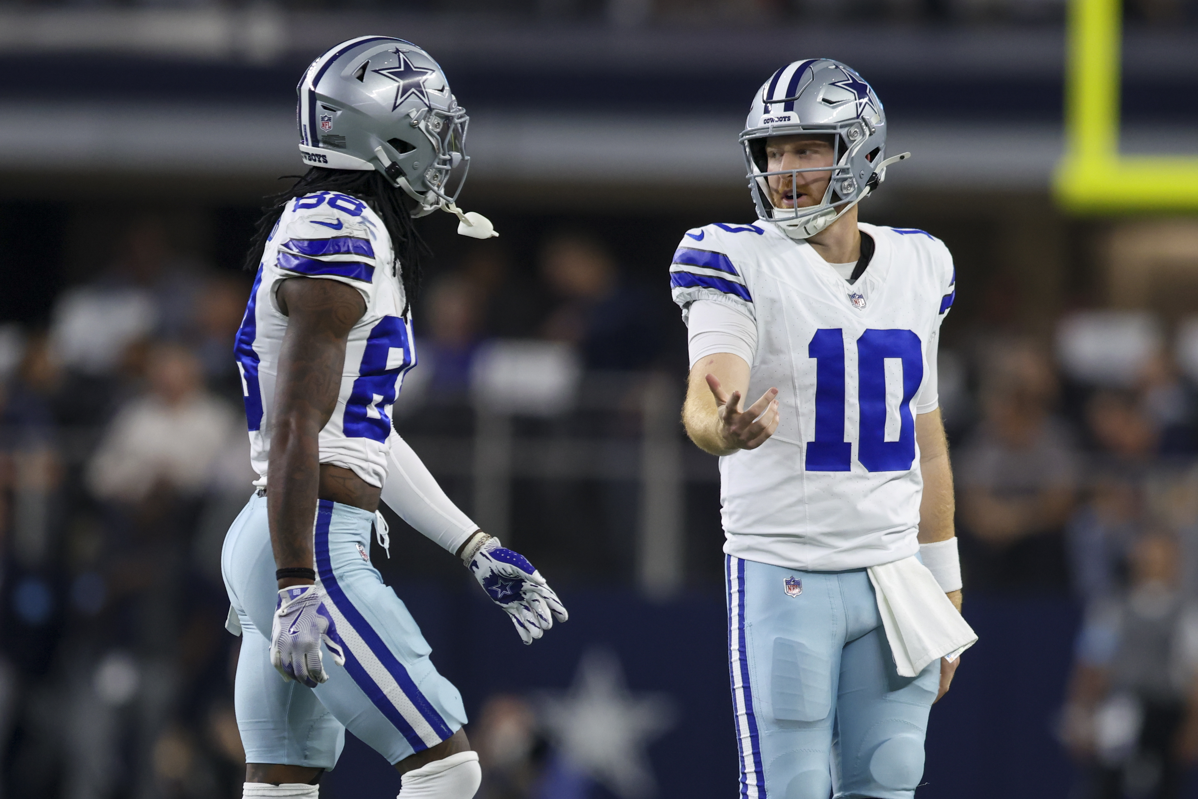 Dallas Cowboys quarterback Cooper Rush (10) and wide receiver CeeDee Lamb walk off the field after Rush threw an interception against the Houston Texans during the first half of an NFL football game, Monday, Nov. 18, 2024, in Arlington, Texas.