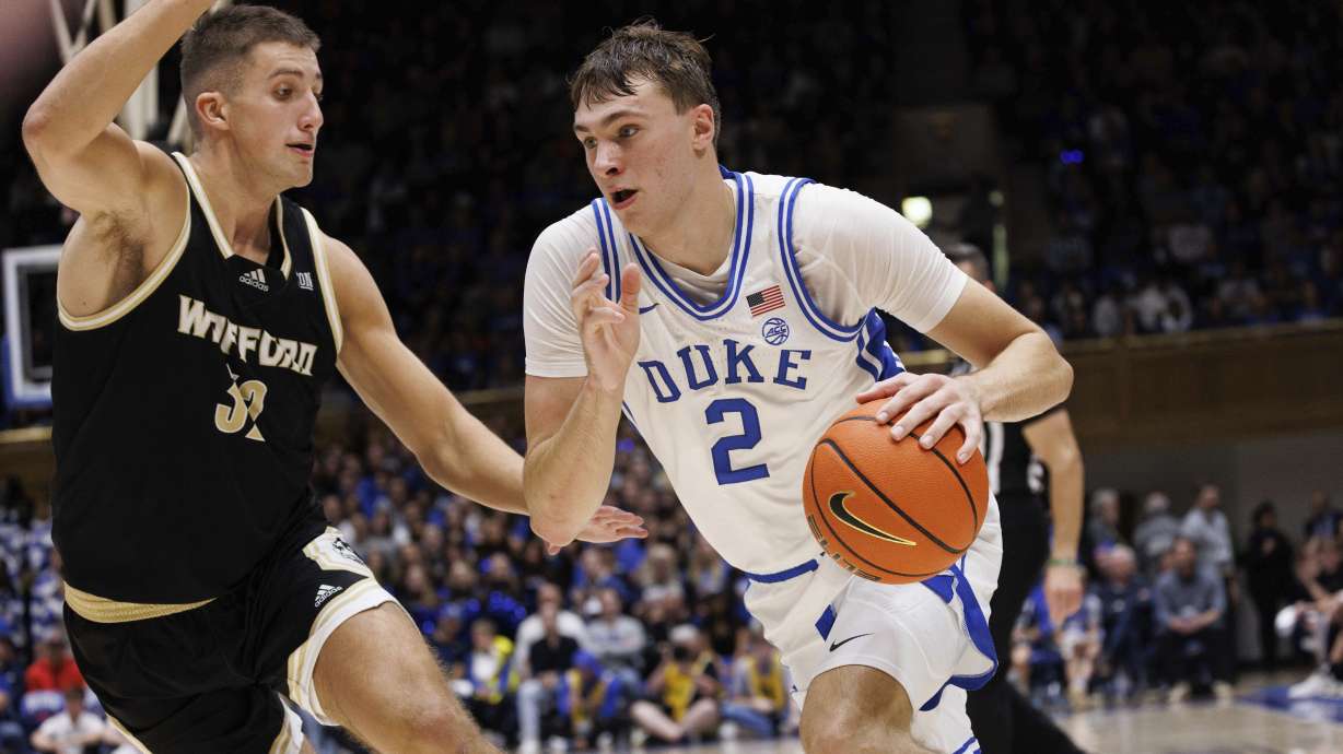 Duke's Cooper Flagg (2) drives as Wofford's Jeremy Lorenz (32) defends during the second half of an NCAA college basketball game in Durham, N.C., Saturday, Nov. 16, 2024.