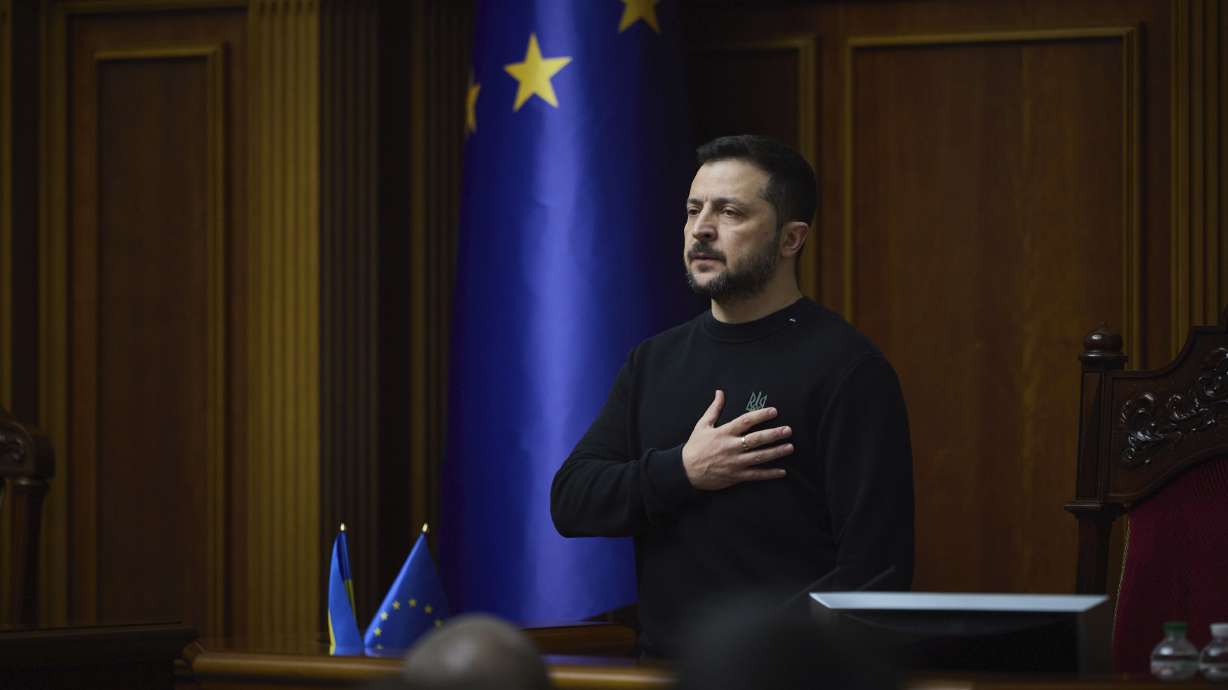 Ukraine's President Volodymyr Zelenskyy listens to the national anthem before his speech at Verkhovna Rada in Kyiv, Ukraine, on Tuesday. The Russian Defense Ministry says Ukraine fired six U.S.-made ATACMS missiles at Russia's Bryansk region.