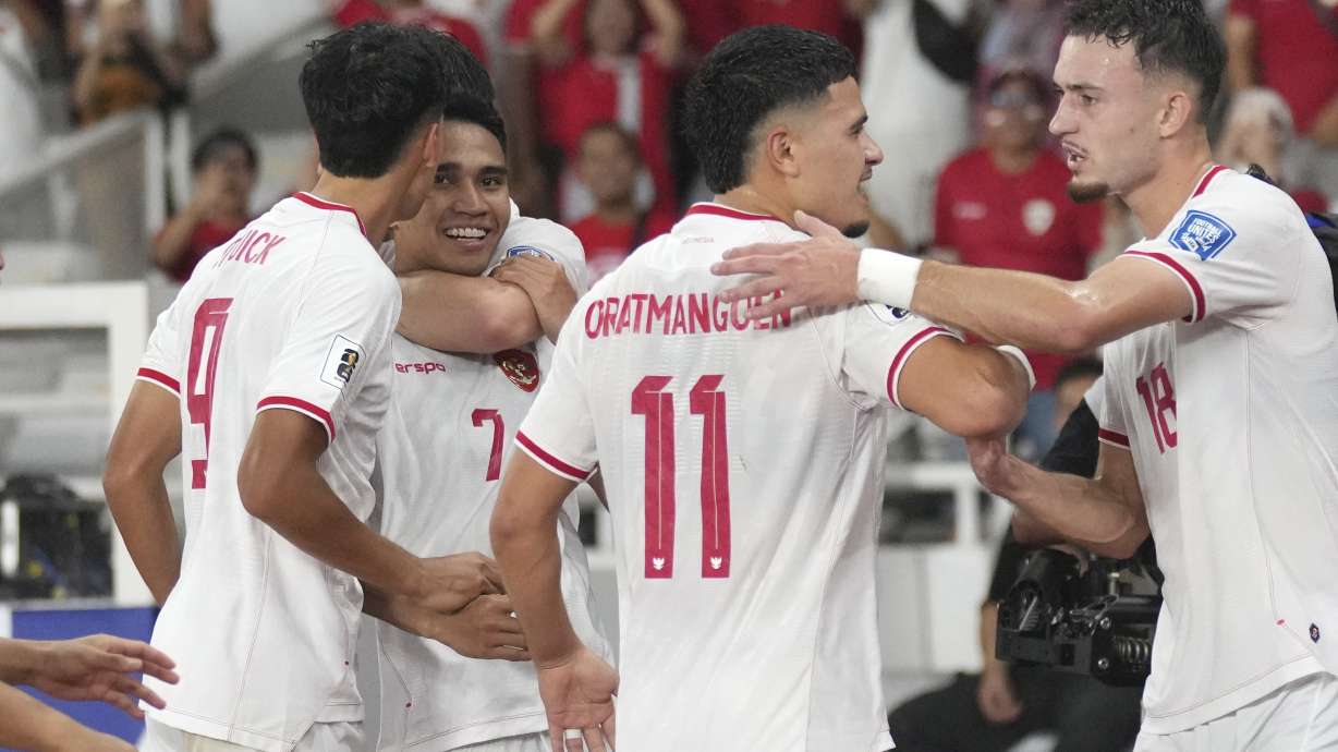 Indonesia's Marselino Ferdinan, 7, celebrates with teammates after scoring a goal during the 2026 World Cup Asian 3rd round qualifier soccer match between Indonesia and Saudi Arabia at Gelora Bung Karno Main Stadium in Jakarta, Indonesia, Tuesday, Nov. 19, 2024.