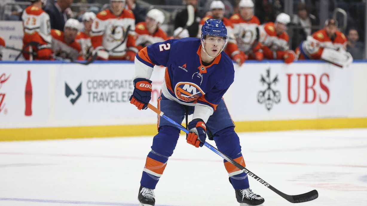 New York Islanders' Mike Reilly controls the puck during the second period of an NHL hockey game against the Anaheim Ducks, Tuesday, Oct. 29, 2024 in Elmont, N.Y.