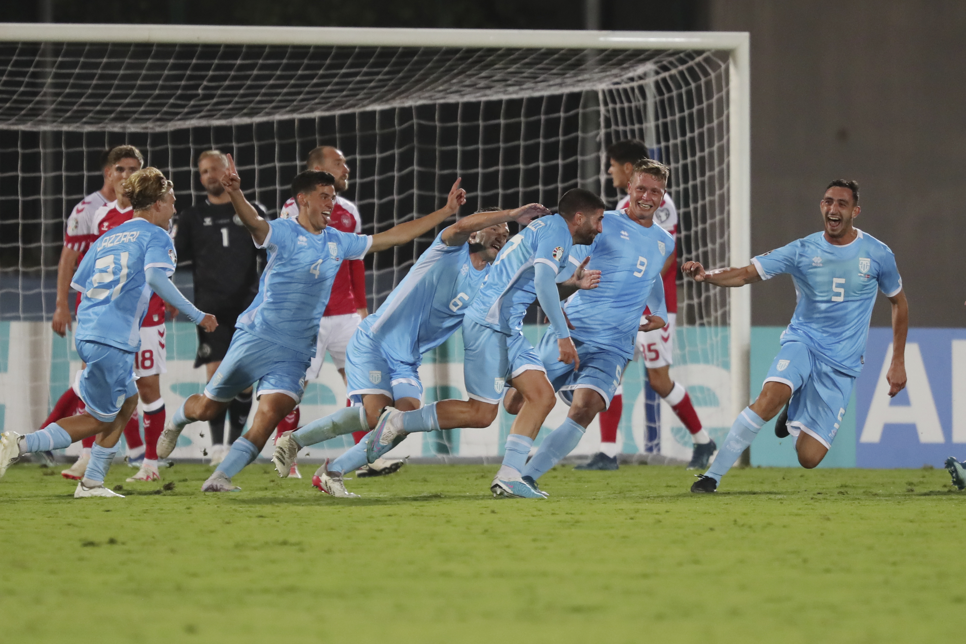 FILE - San Marino's Alessandro Golinucci, fourth right, celebrates with his teammates after scoring his side's opening goal during the Euro 2024 group H qualifying soccer match between San Marino and Denmark at the San Marino Stadium in Serravalle, San Marino, Oct. 17, 2023. 