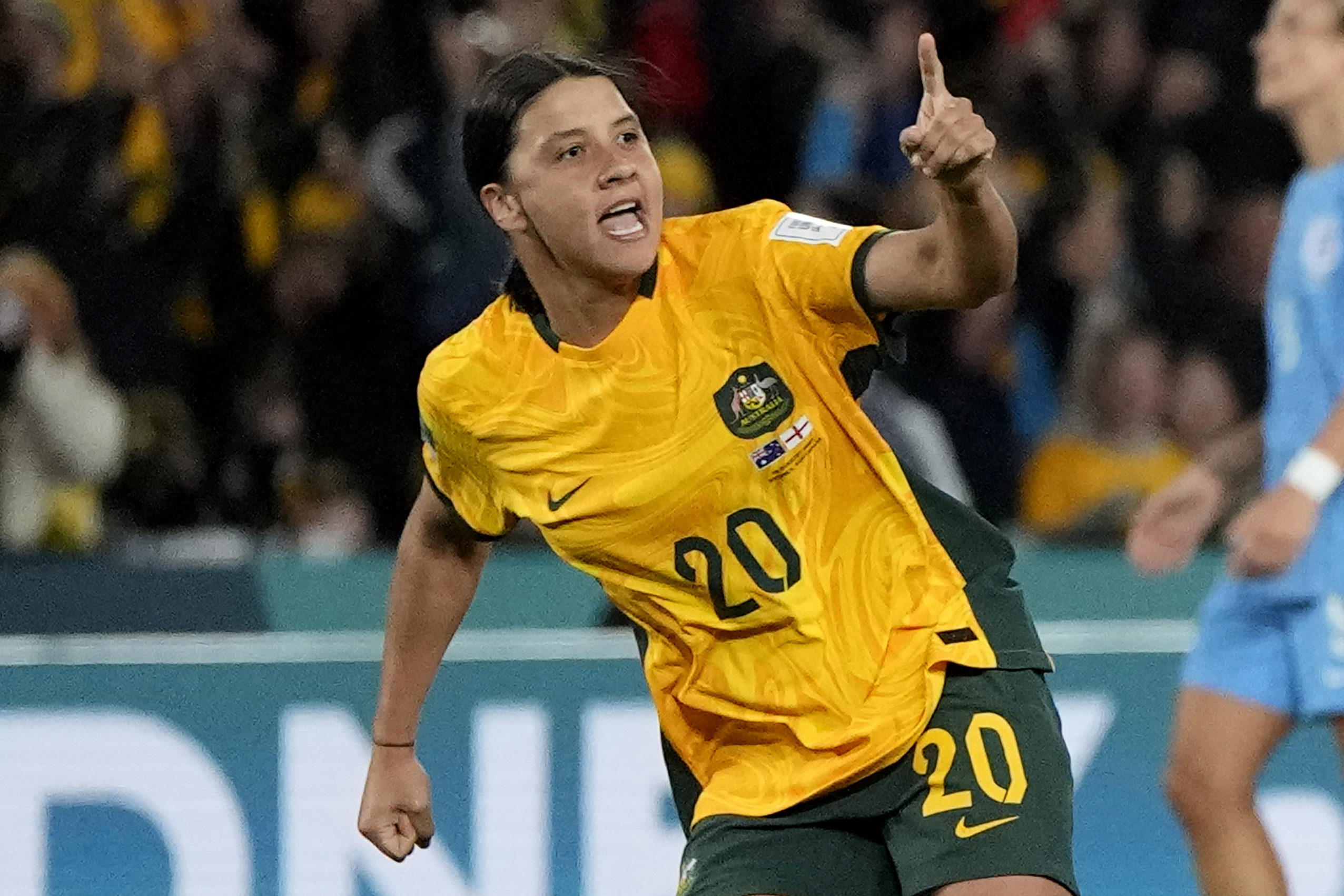 FILE - Australia's Sam Kerr celebrates after scoring her side's first goal during the Women's World Cup semifinal soccer match between Australia and England at Stadium Australia in Sydney, Australia, on Aug. 16, 2023. 