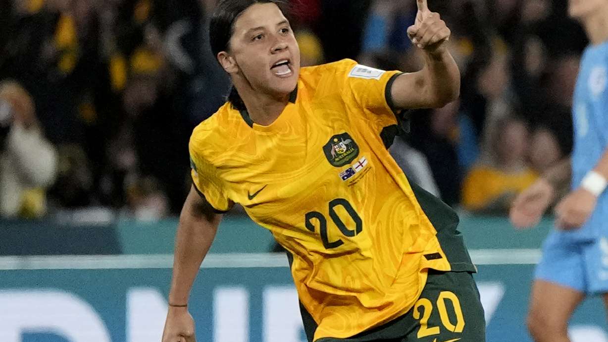 FILE - Australia's Sam Kerr celebrates after scoring her side's first goal during the Women's World Cup semifinal soccer match between Australia and England at Stadium Australia in Sydney, Australia, on Aug. 16, 2023.