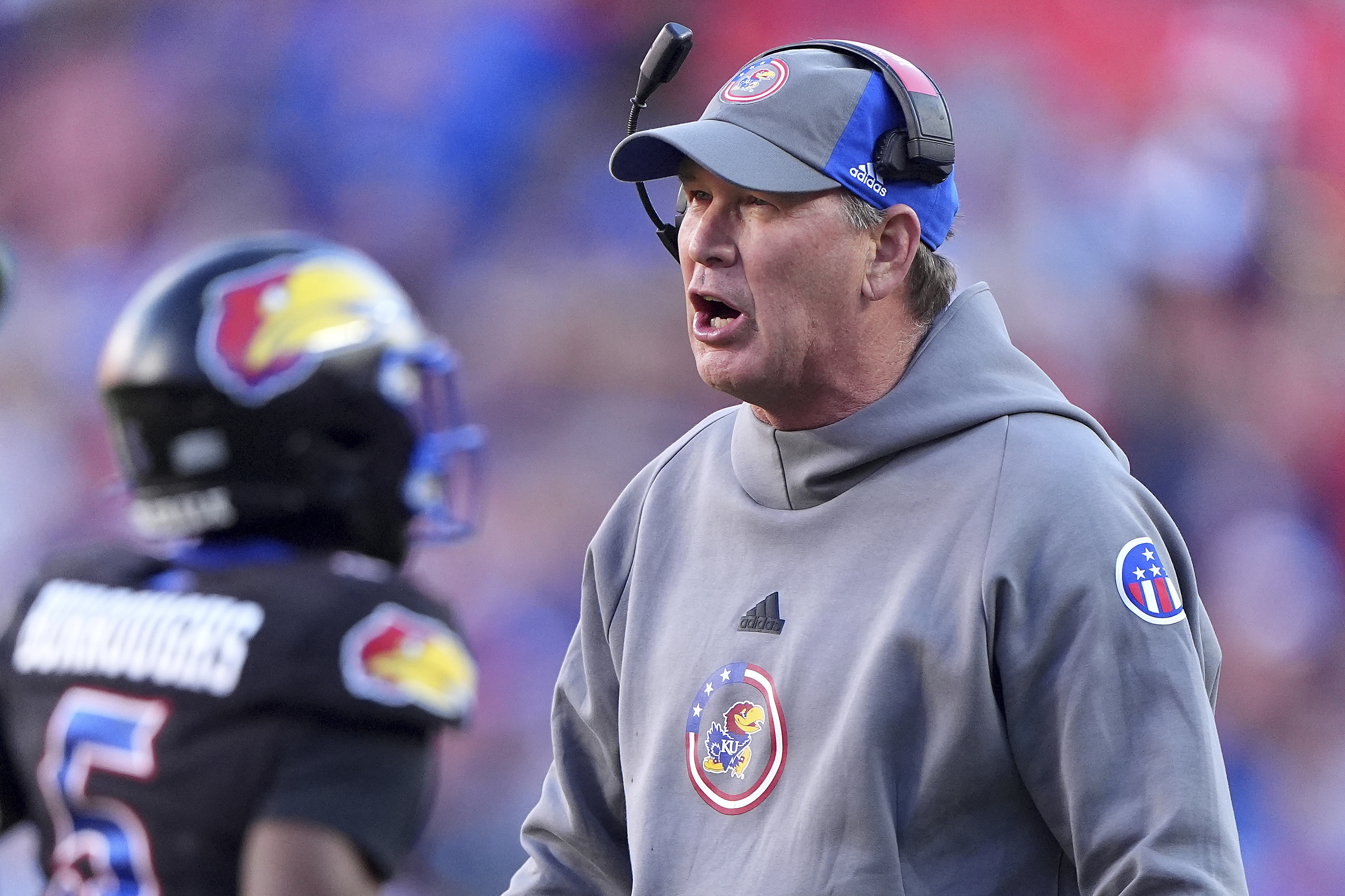 Kansas head coach Lance Leipold talks to his players during the first half of an NCAA college football game against Iowa State Saturday, Nov. 9, 2024, in Kansas City, Mo. 