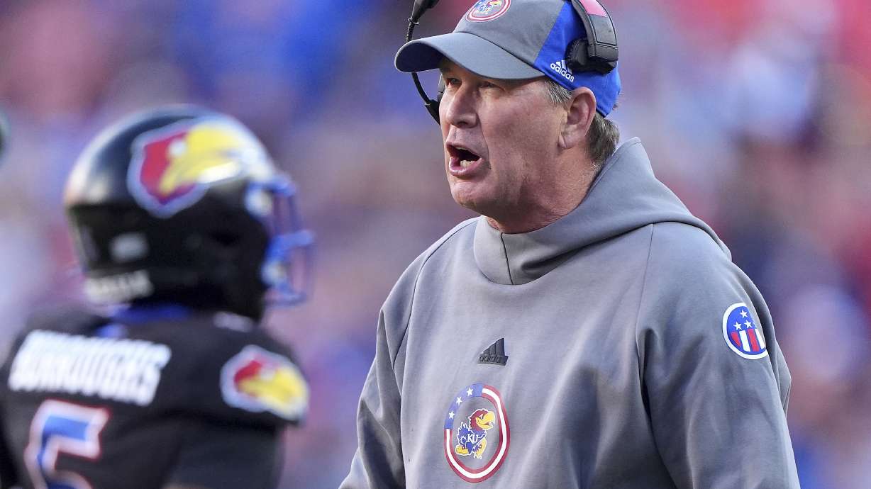 Kansas head coach Lance Leipold talks to his players during the first half of an NCAA college football game against Iowa State Saturday, Nov. 9, 2024, in Kansas City, Mo.