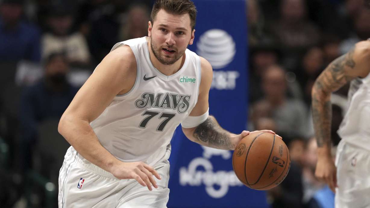 Dallas Mavericks guard Luka Doncic brings the ball up the court during the first half of an NBA basketball game against the San Antonio Spurs Saturday, Nov. 16, 2024, in Dallas.