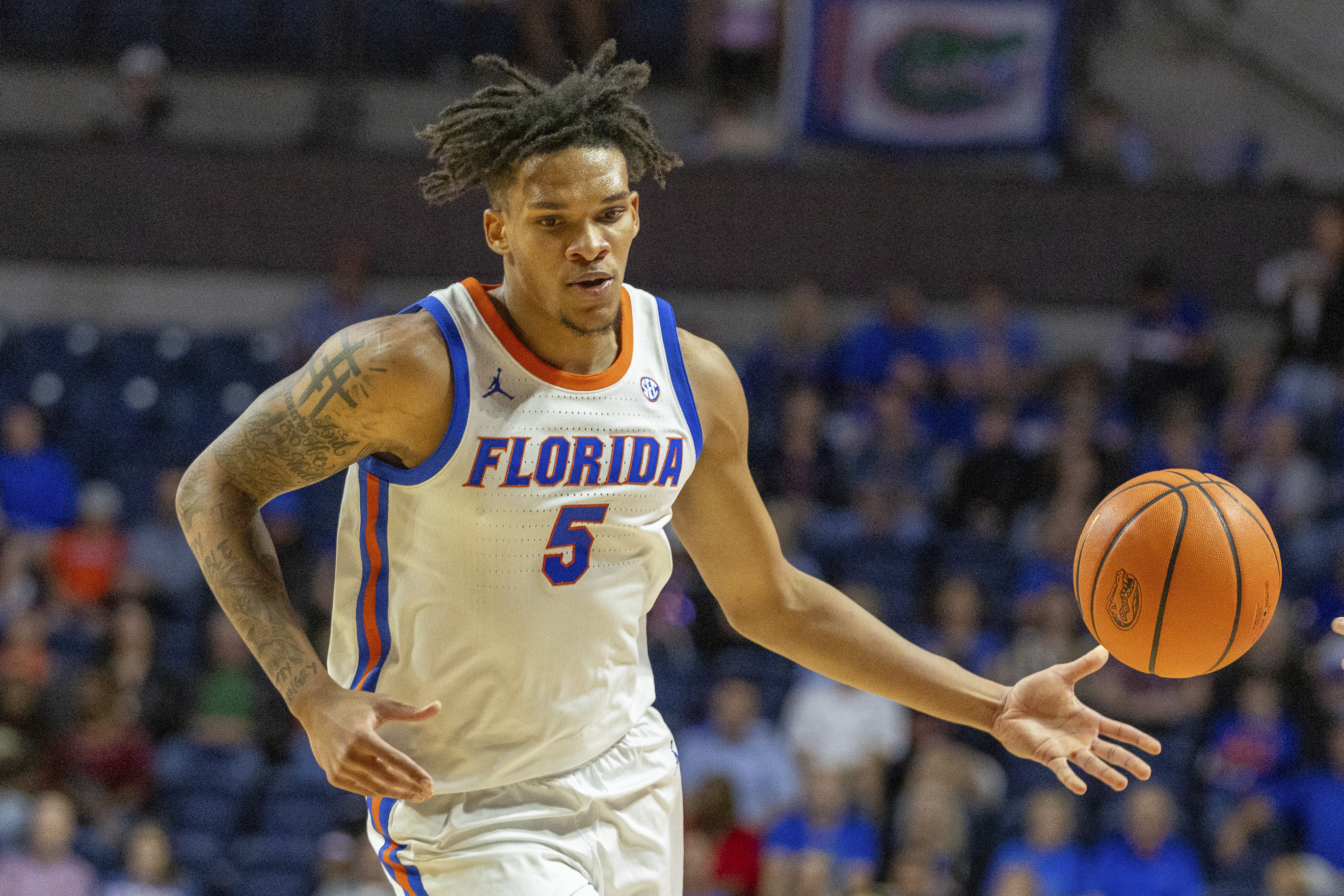 Florida guard Will Richard (5) passes during the first half of an NCAA college basketball game against Florida A&M, Tuesday, Nov. 19, 2024, in Gainesville, Fla. 