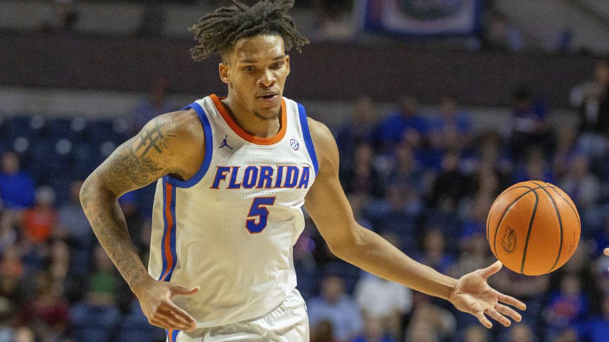 Florida guard Will Richard (5) passes during the first half of an NCAA college basketball game against Florida A&M, Tuesday, Nov. 19, 2024, in Gainesville, Fla.