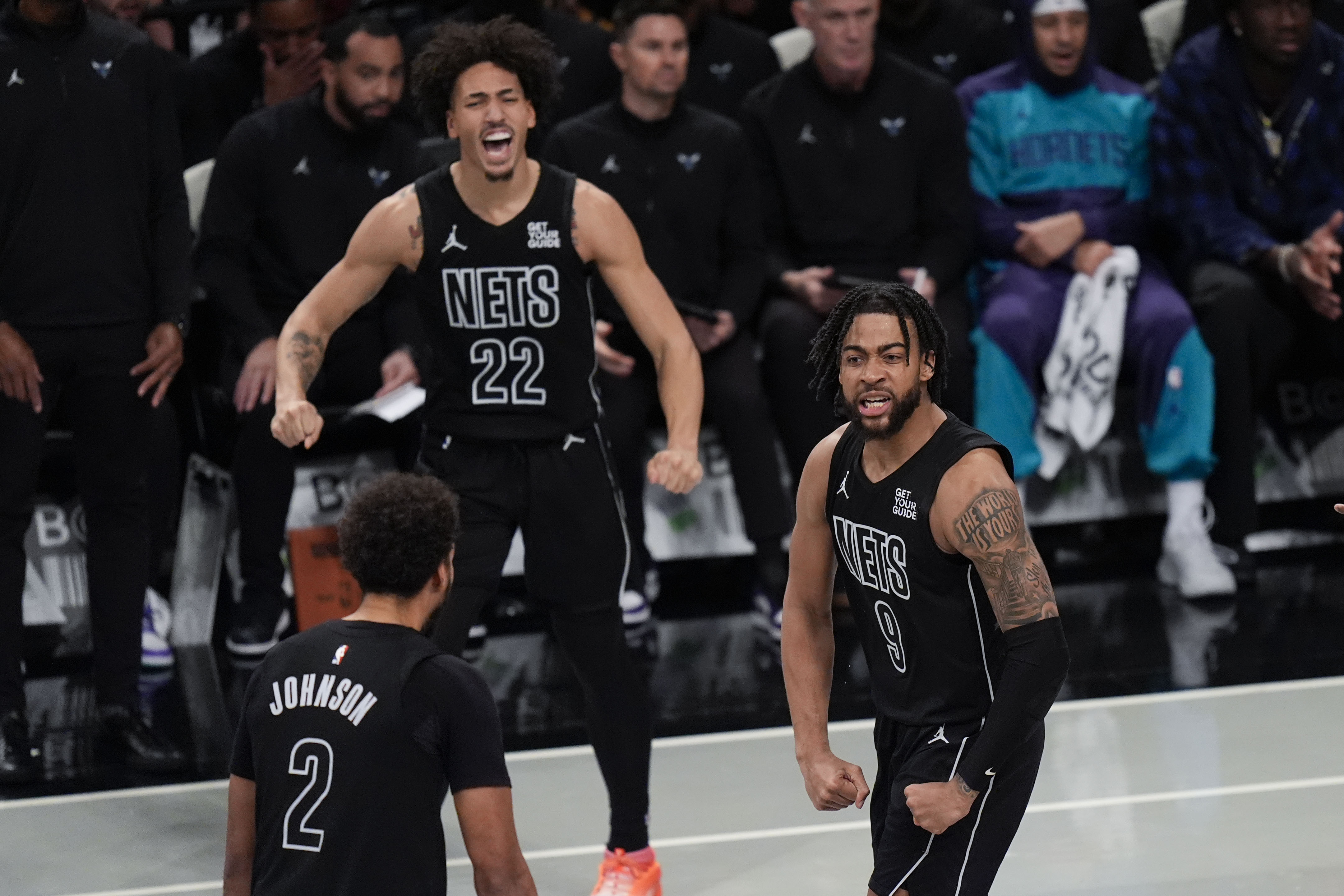 Brooklyn Nets' Trendon Watford, right, reacts after making a basket during the second half of an Emirates NBA Cup basketball game against the Charlotte Hornets, Tuesday, Nov. 19, 2024, in New York. 