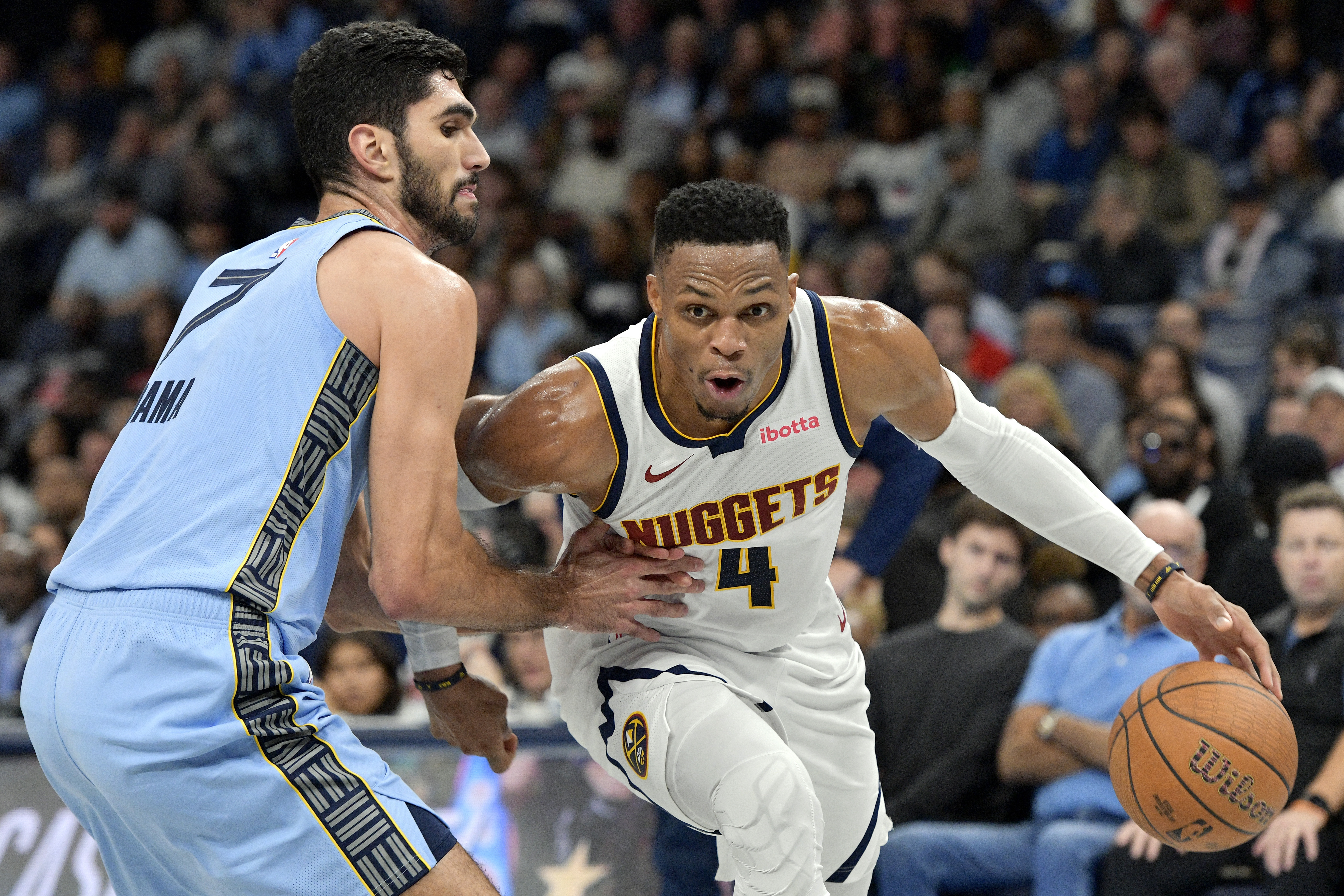 Denver Nuggets guard Russell Westbrook (4) handles the ball against Memphis Grizzlies forward Santi Aldama (7) in the second half of an Emirates NBA Cup basketball game Tuesday, Nov. 19, 2024, in Memphis, Tenn. 