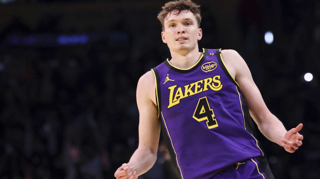 Los Angeles Lakers guard Dalton Knecht celebrates after scoring a 3-pointer during the second half of an Emirates NBA Cup basketball game against the Utah Jazz, Tuesday, Nov. 19, 2024, in Los Angeles.