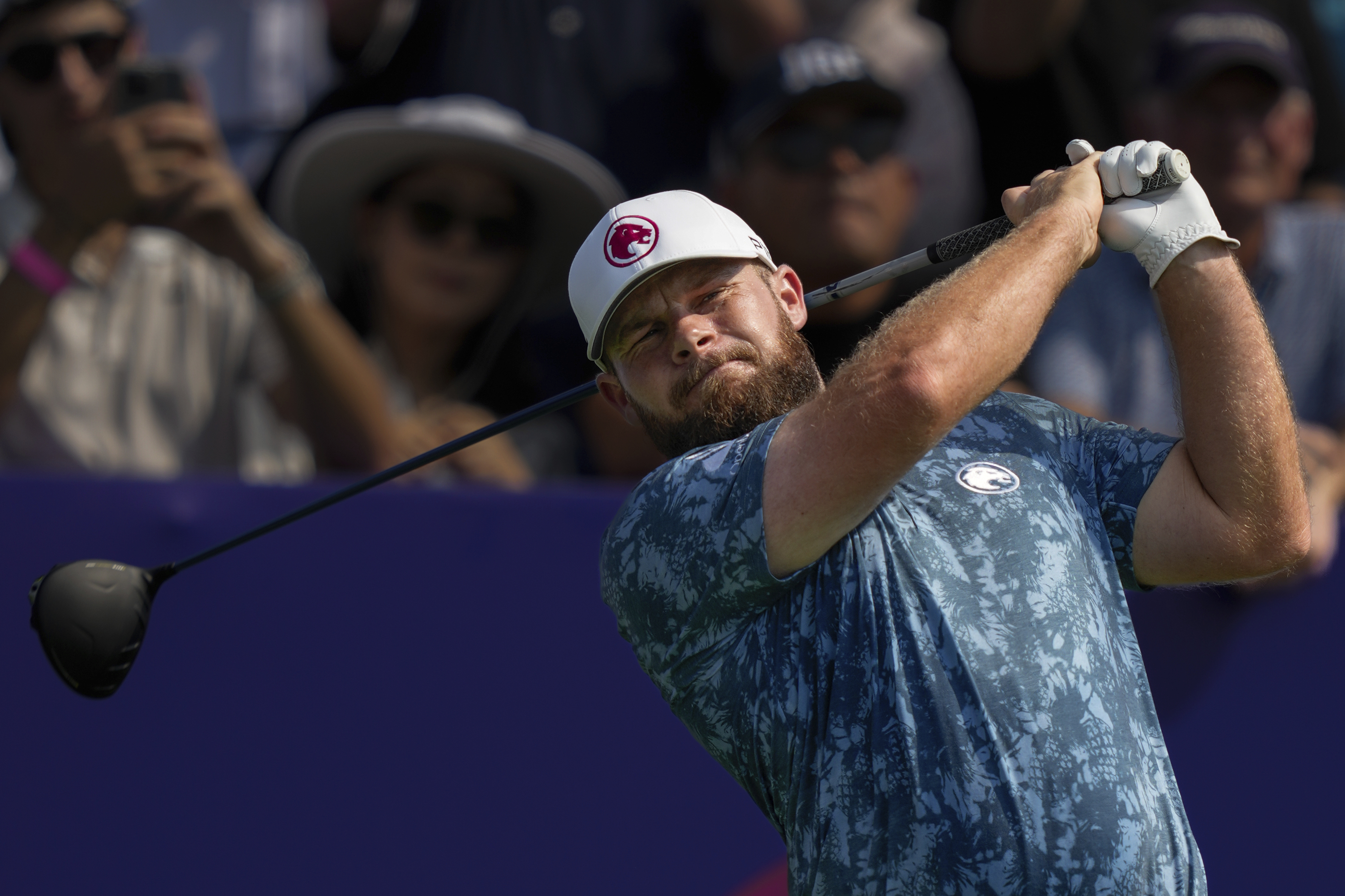 Tyrell Hatton of England hits off the first tee during the first round of World Tour Golf Championship in Dubai, United Arab Emirates, Thursday, Nov. 14, 2024.