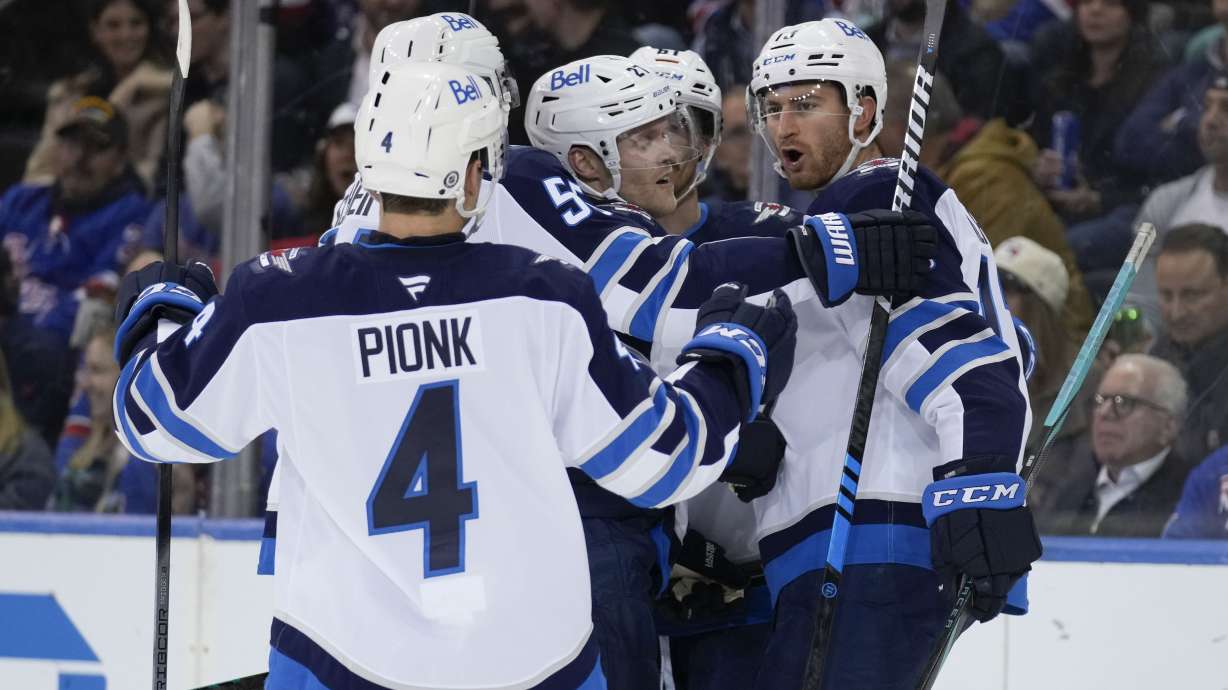Winnipeg Jets' Gabriel Vilardi, right, celebrates his goal with teammates during the second period of an NHL hockey game against the New York Rangers Tuesday, Nov. 12, 2024, in New York.