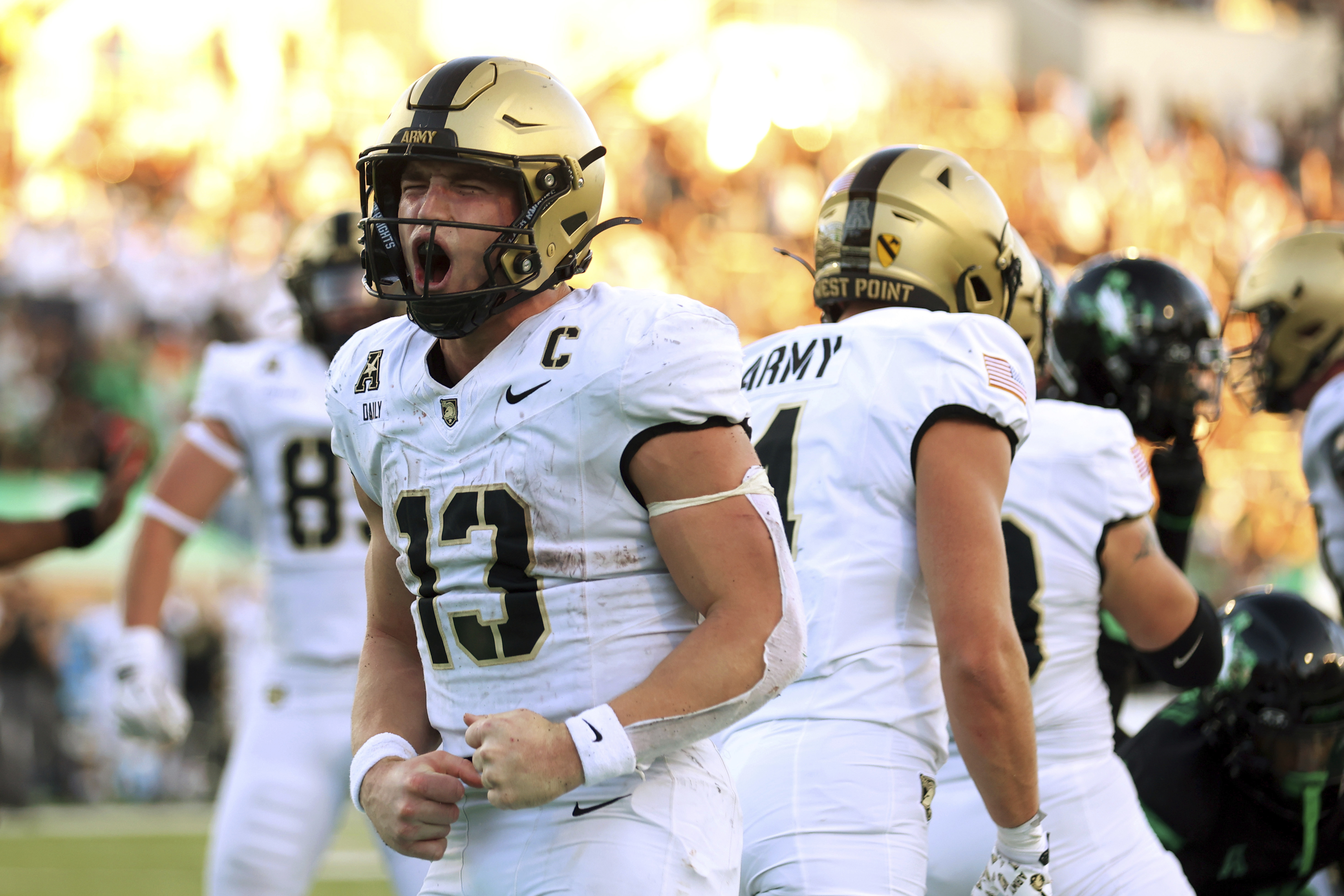 Army quarterback Bryson Daily (13) celebrates after a touchdown against North Texas in the second half of an NCAA football game Saturday, Nov. 9, 2024, in Denton, TX. 